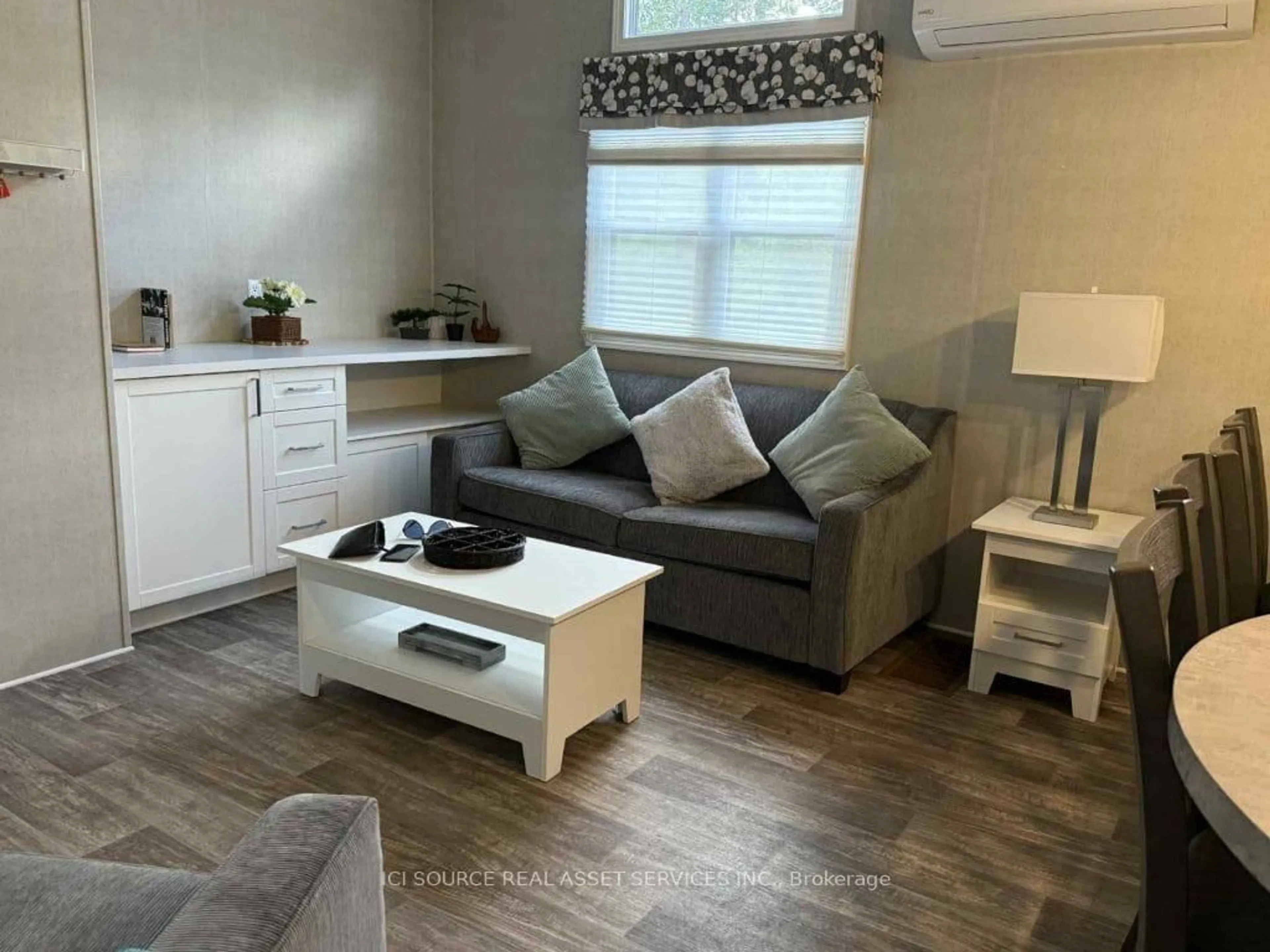 Living room with furniture, wood/laminate floor for 1047 Bonnie Lake Camp Rd #BBT097, Bracebridge Ontario P1L 1W9