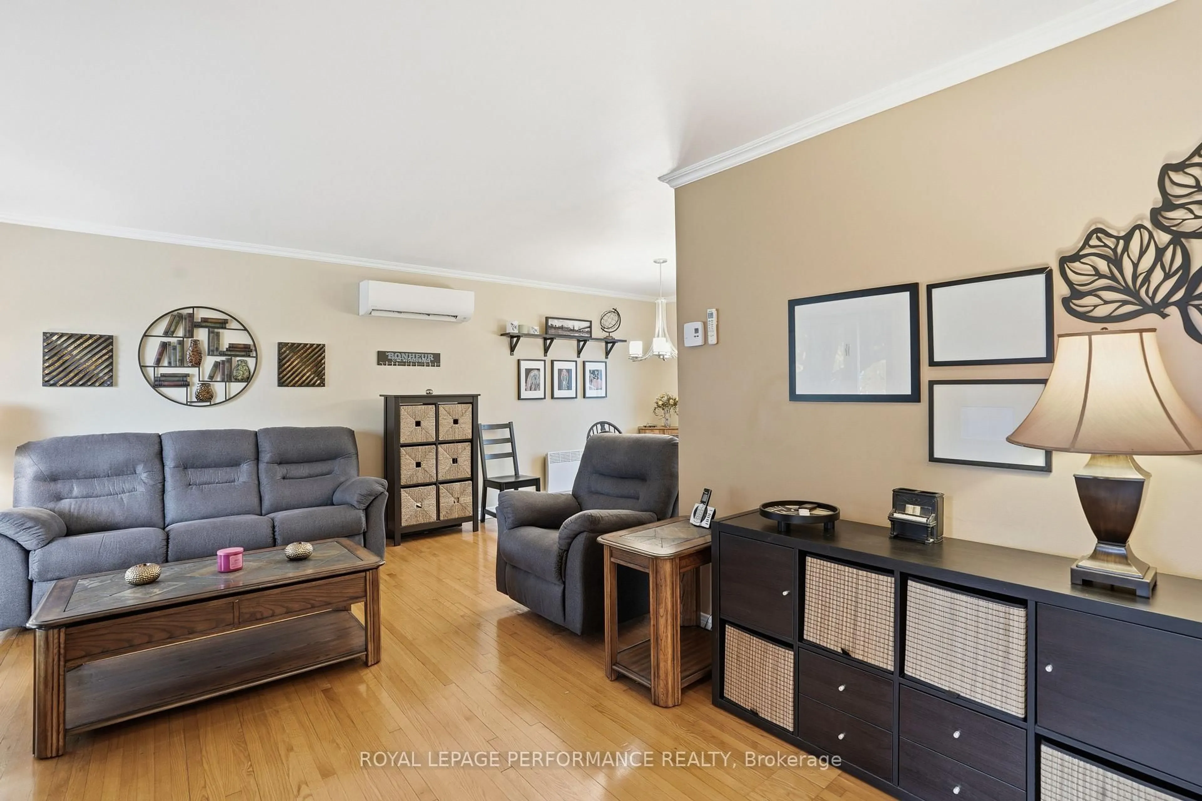 Living room with furniture, wood/laminate floor for 760 Cartier Blvd, Hawkesbury Ontario K6A 1W7