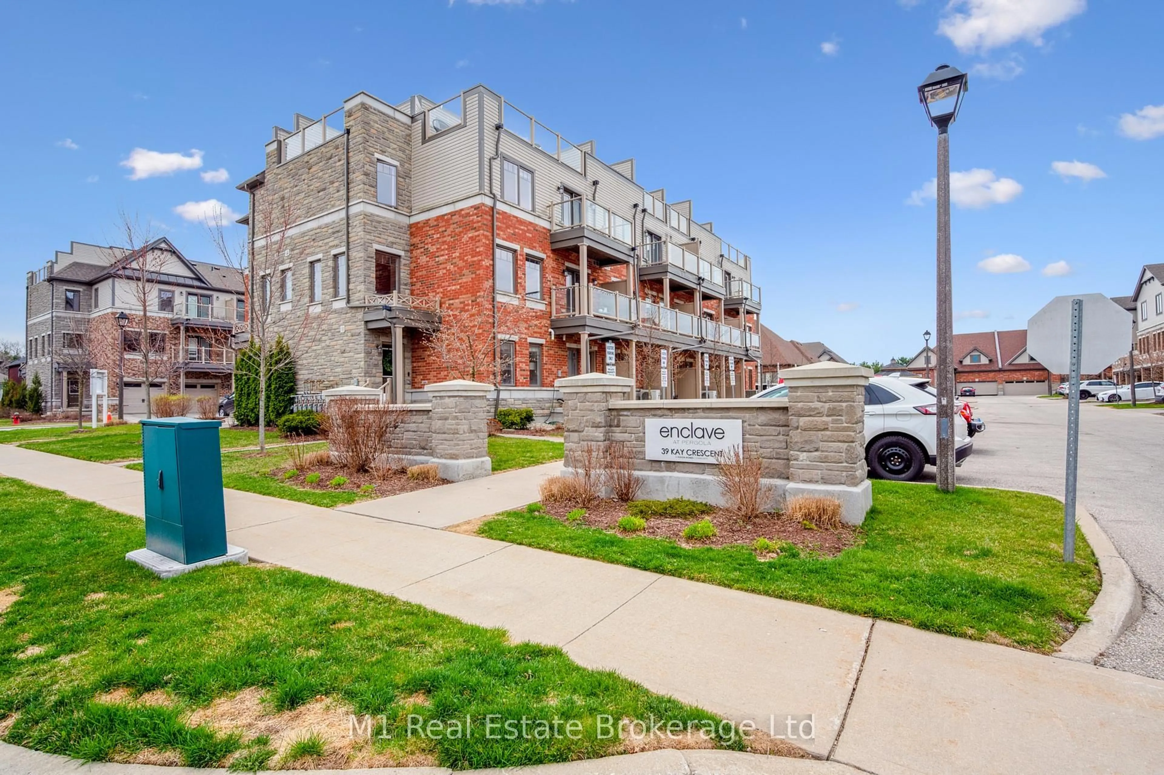 A pic from outside/outdoor area/front of a property/back of a property/a pic from drone, street for 39 Kay Cres #34, Guelph Ontario N1L 0N5