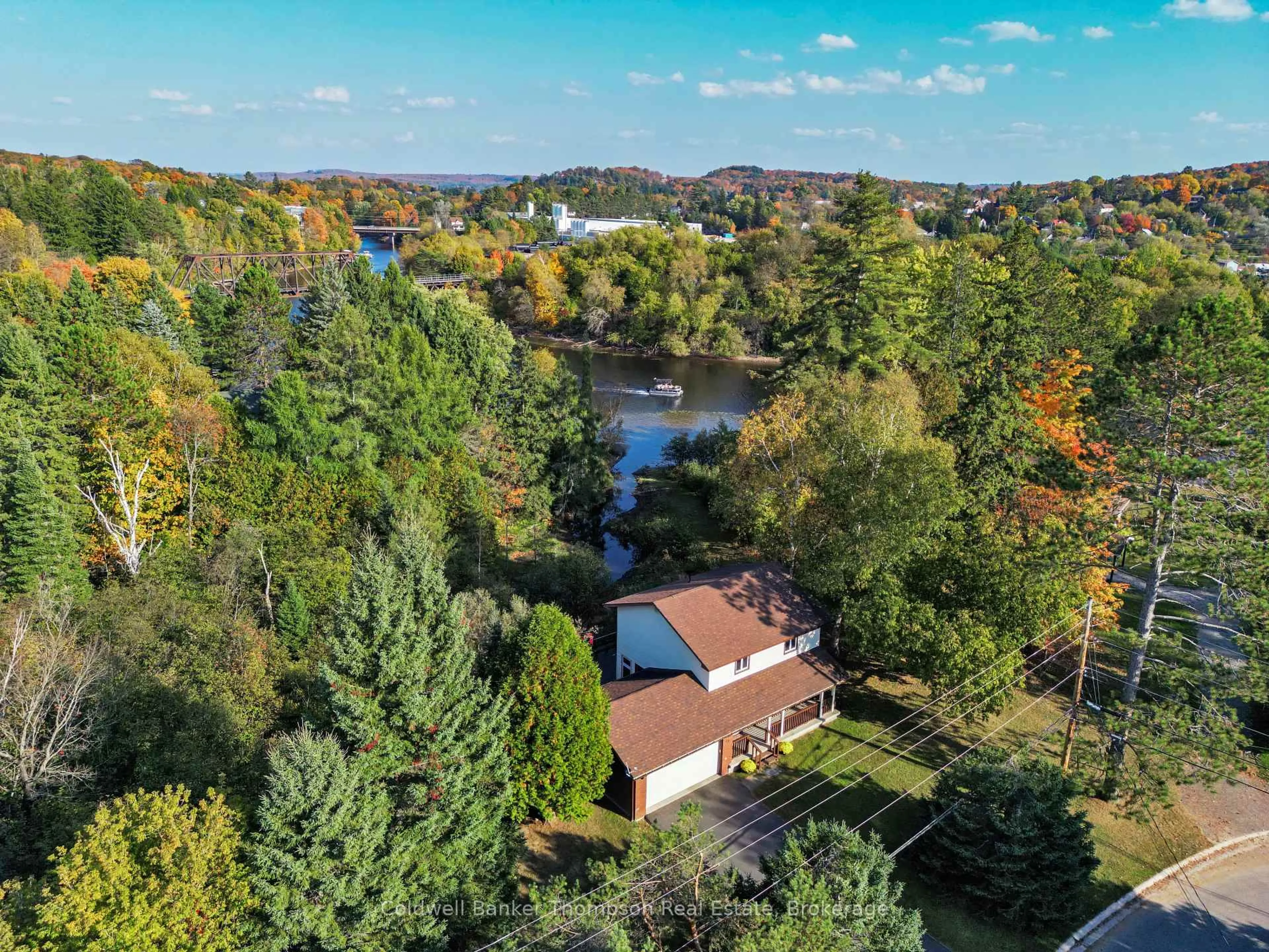 A pic from outside/outdoor area/front of a property/back of a property/a pic from drone, water/lake/river/ocean view for 41 Hodges Lane, Huntsville Ontario P1H 1M7