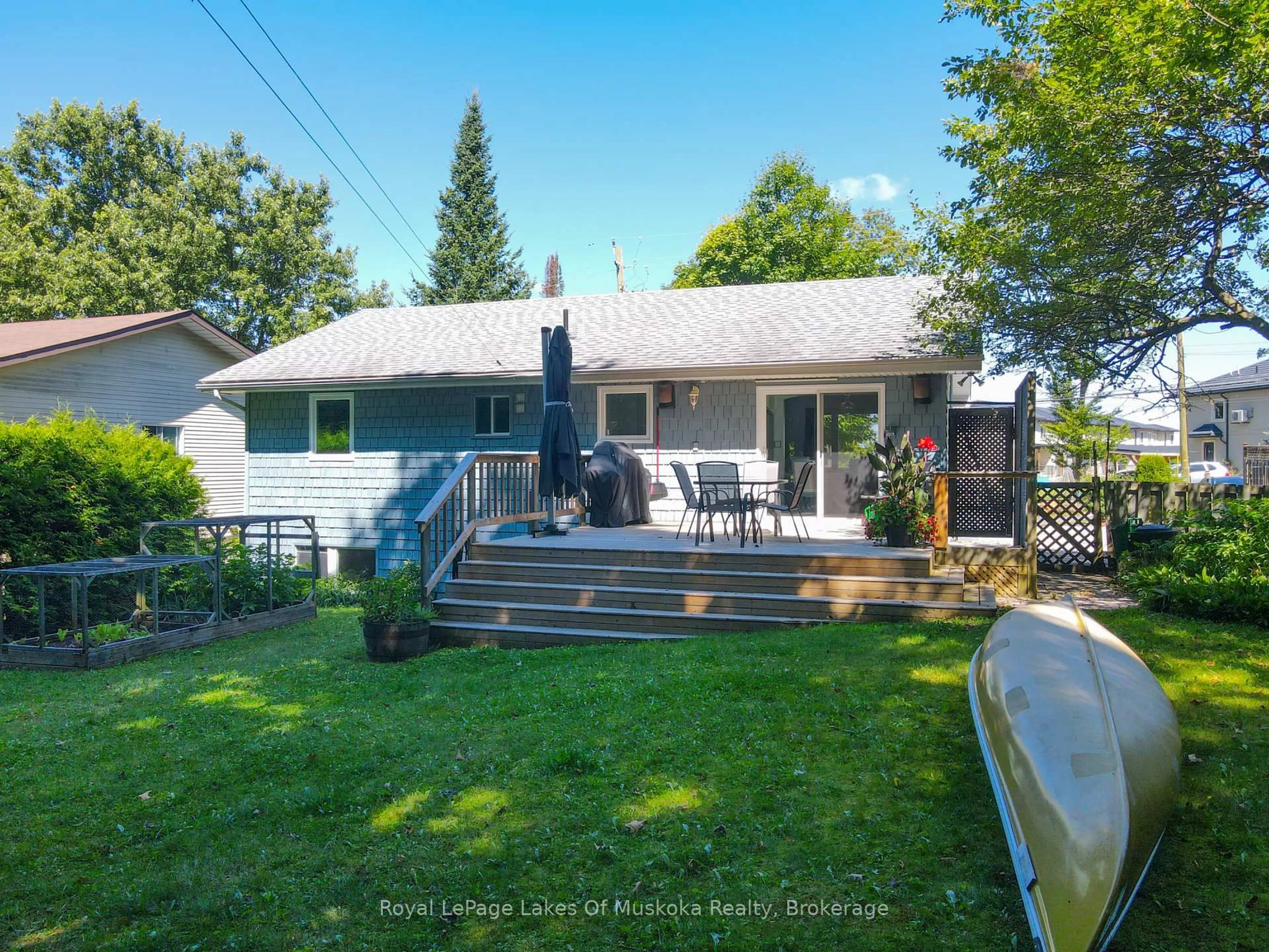 A pic from outside/outdoor area/front of a property/back of a property/a pic from drone, water/lake/river/ocean view for 63 Florence St, Huntsville Ontario P1H 1V4