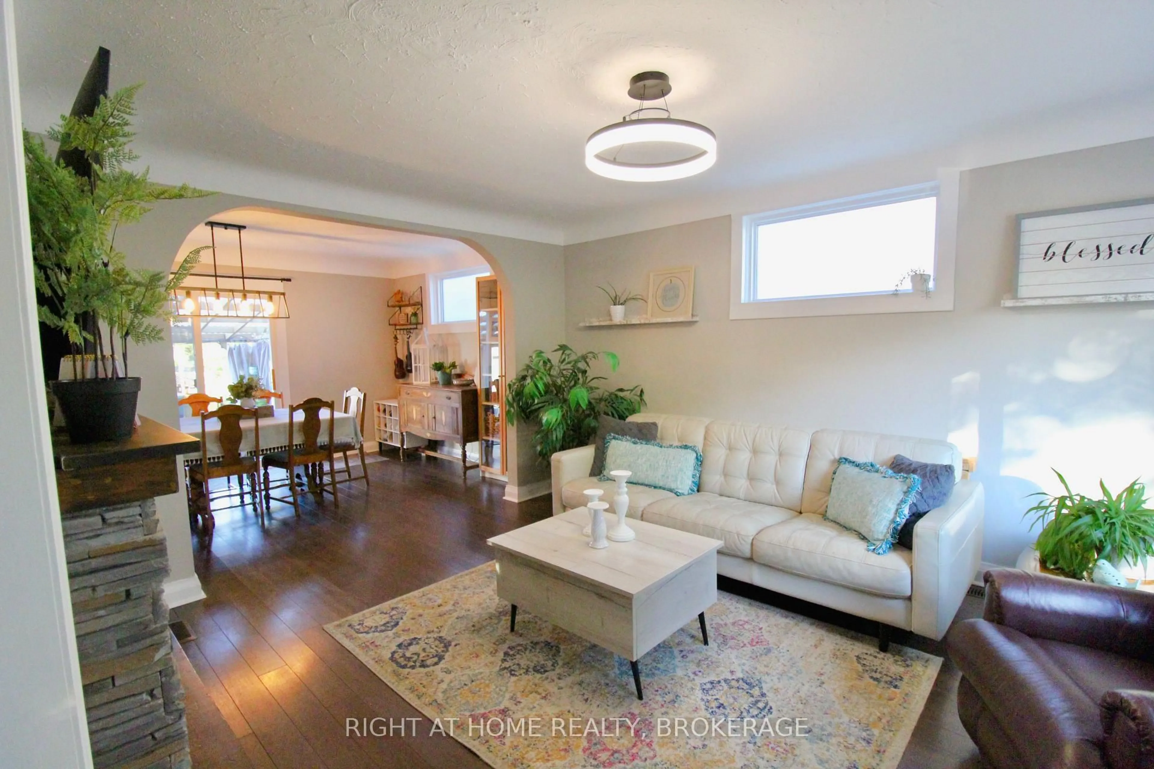 Living room with furniture, wood/laminate floor for 7 Cedardale Ave, St. Catharines Ontario L2P 1B1