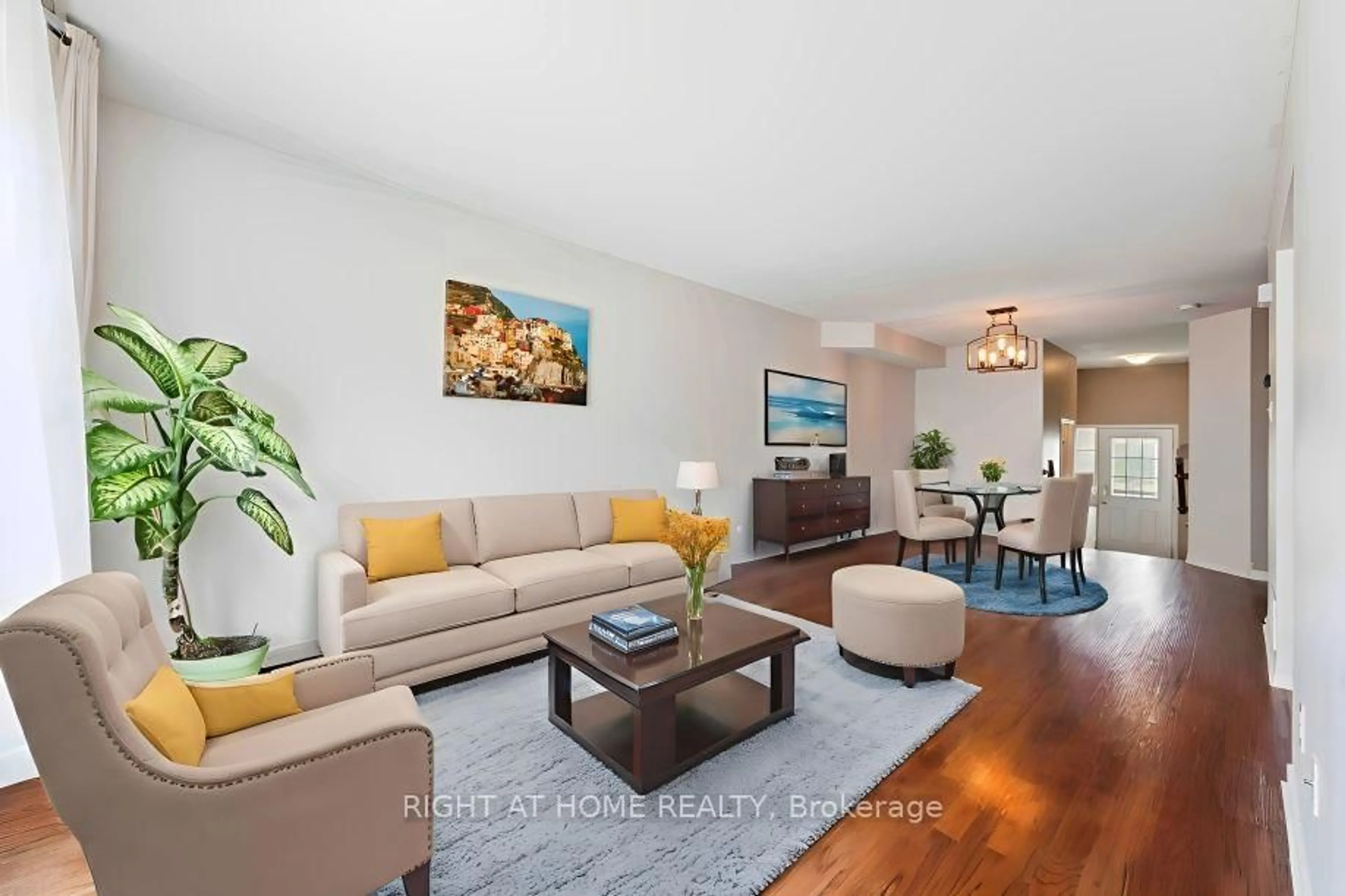 Living room with furniture, wood/laminate floor for 142 Lokoya St, Ottawa Ontario K2S 0J4