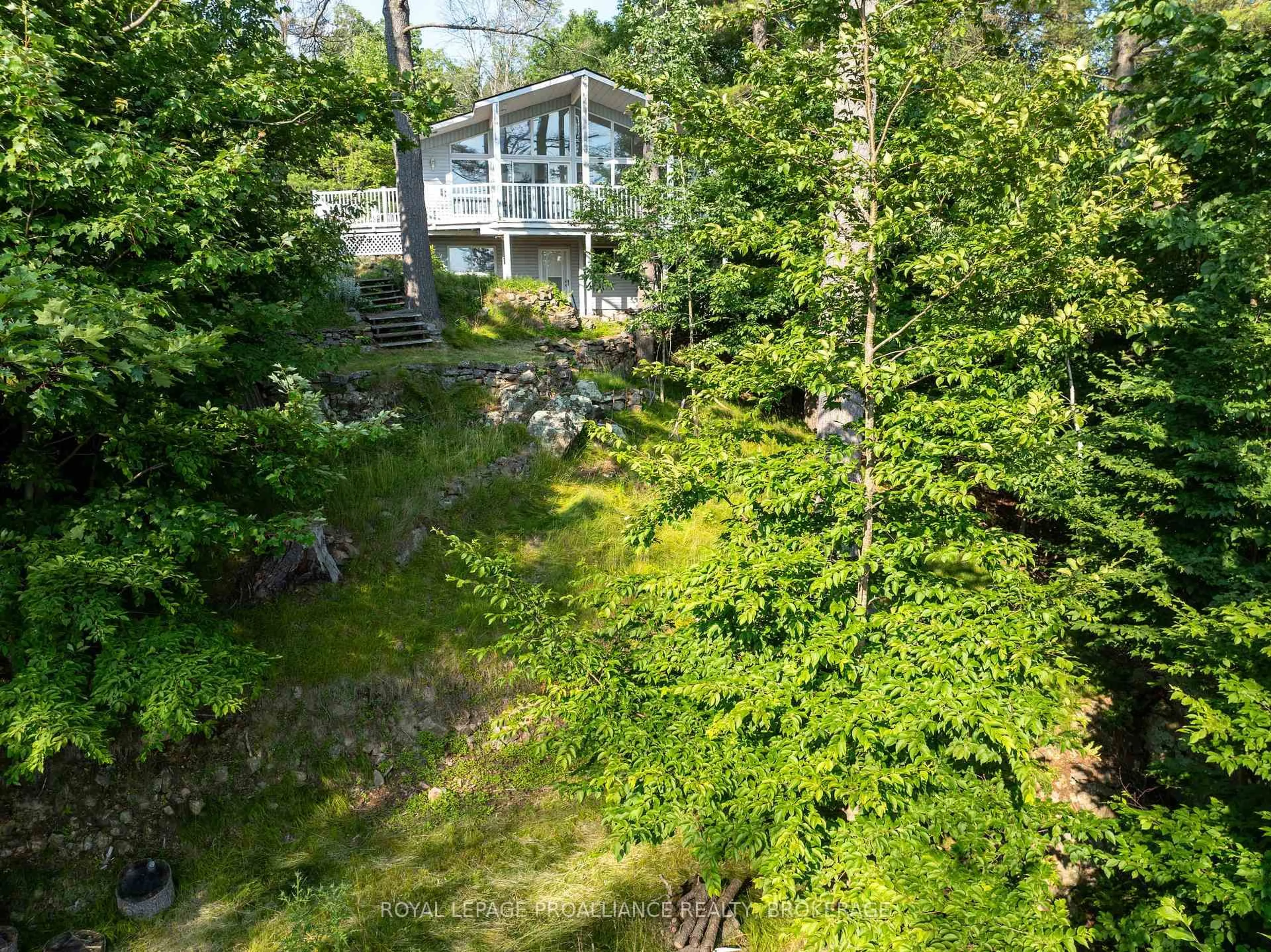 A pic from outside/outdoor area/front of a property/back of a property/a pic from drone, forest/trees view for 182A Brooks Point Rd, Rideau Lakes Ontario K0G 1E0
