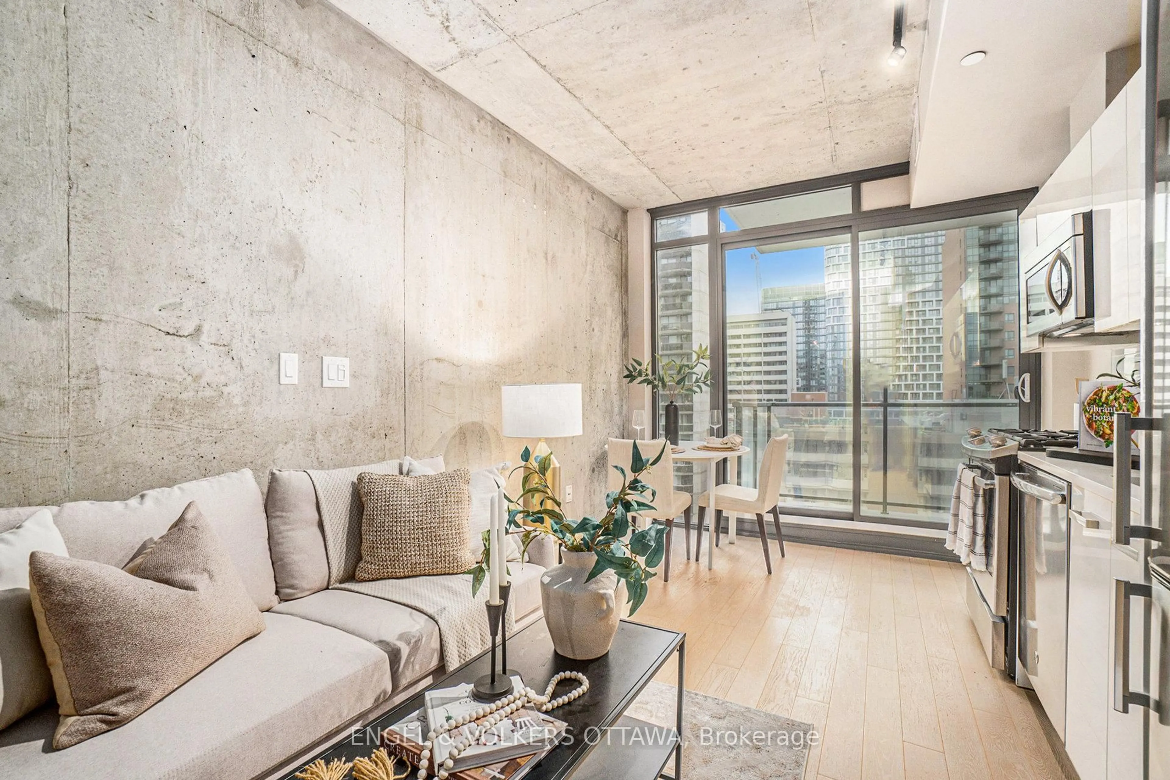 Living room with furniture, cement floor for 224 Lyon St #1113, Ottawa Ontario K1R 5V9