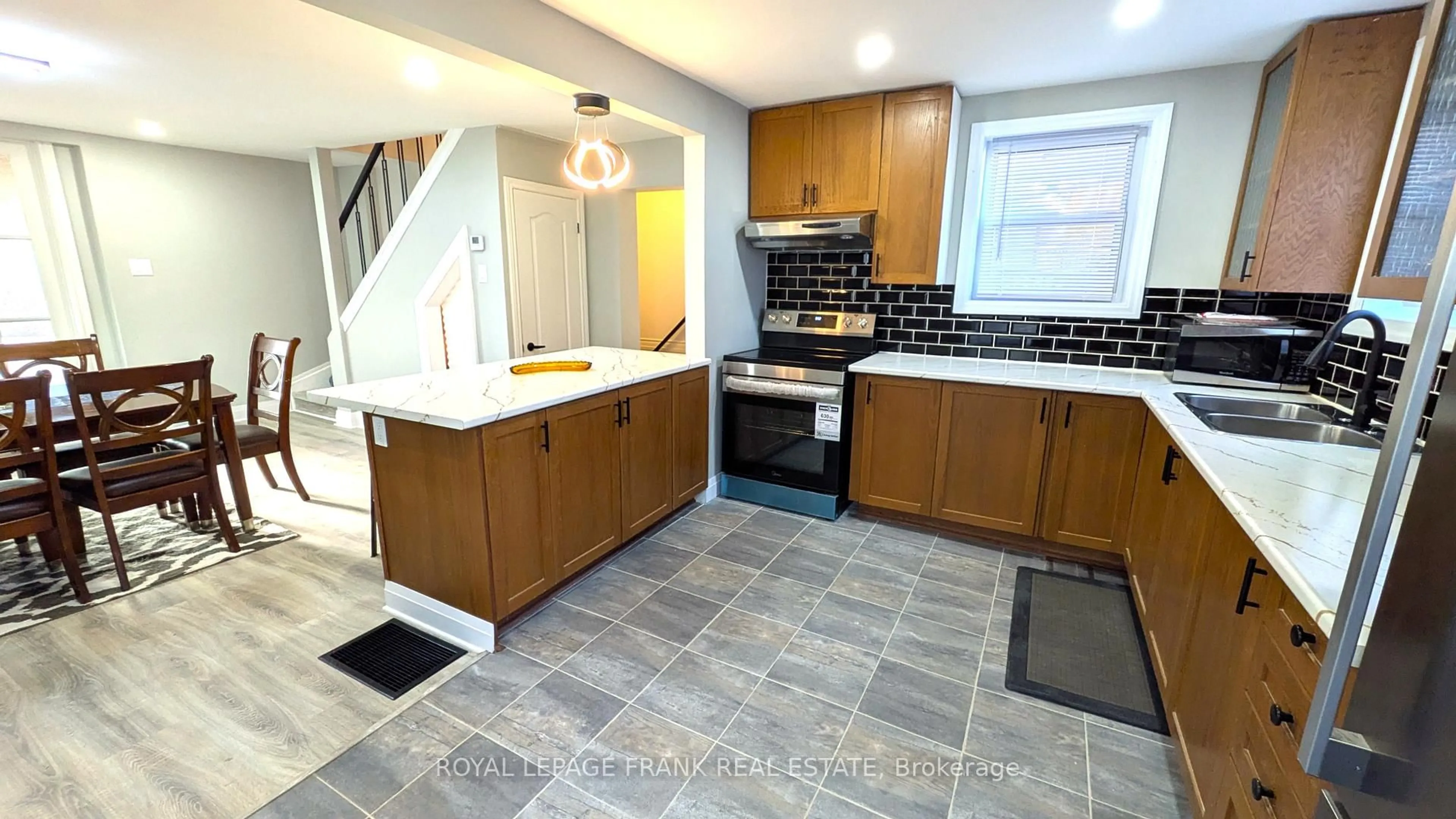 Open concept kitchen, ceramic/tile floor for 23 N Hastings Ave, Limoges Ontario K0K 2M0
