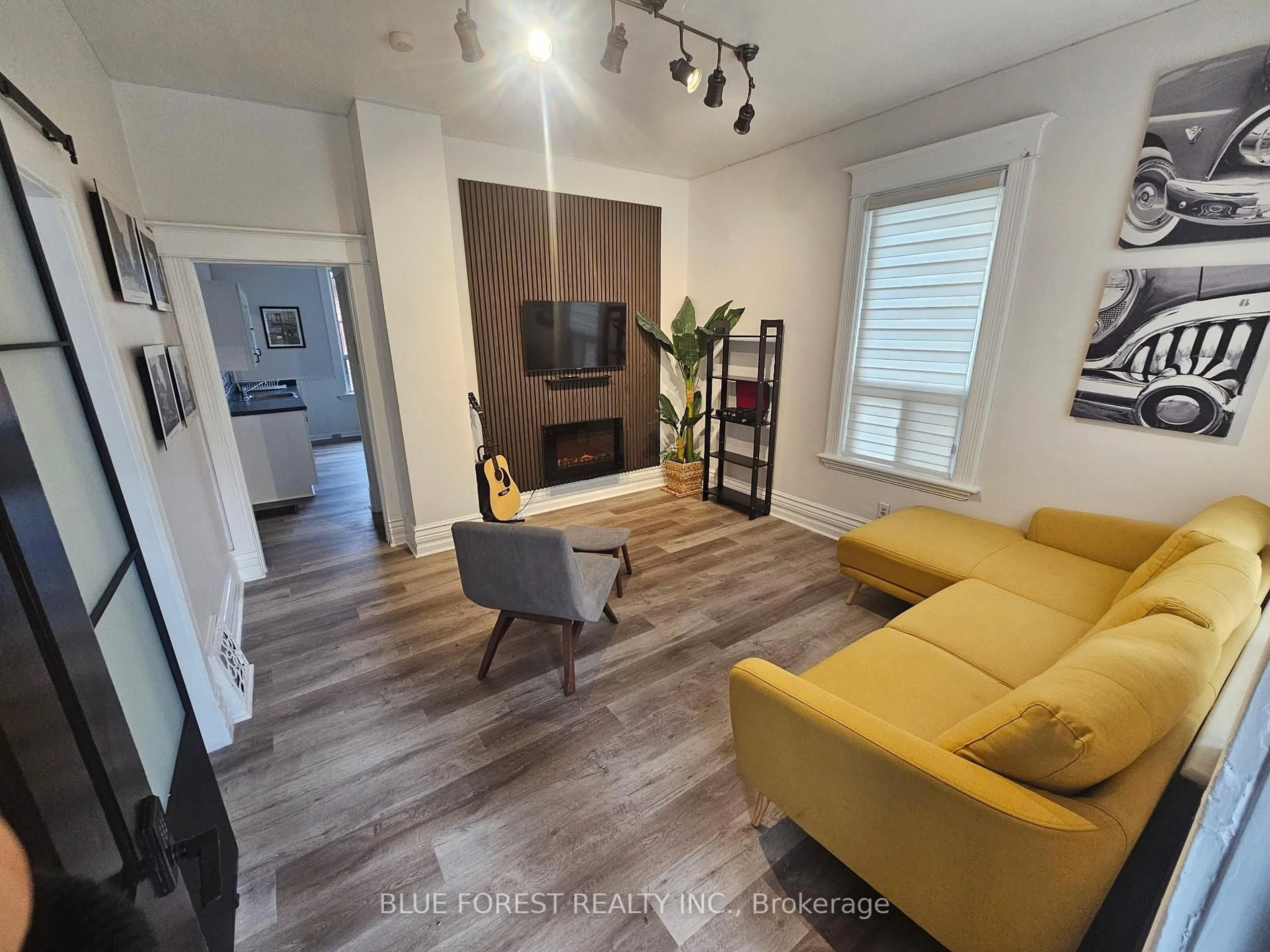 Living room with furniture, wood/laminate floor for 42 Terrace St, London South Ontario N5Z 2X4