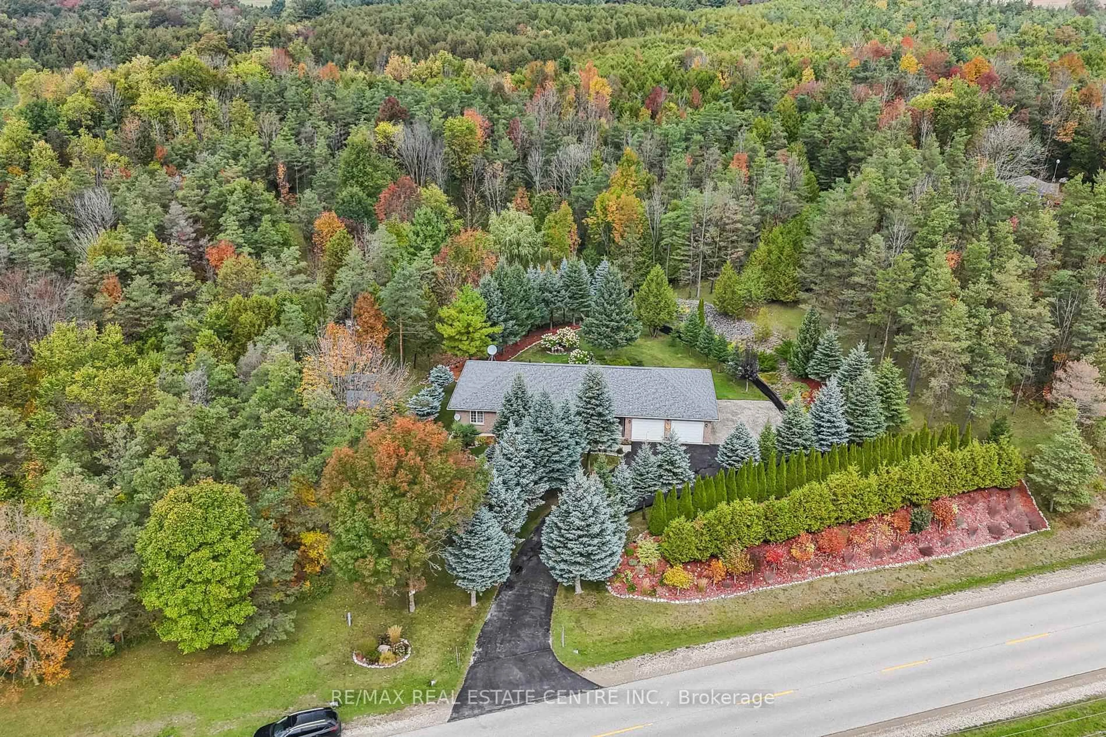 A pic from outside/outdoor area/front of a property/back of a property/a pic from drone, forest/trees view for 122769 GREY 9 Rd, West Grey Ontario N0G 1C0