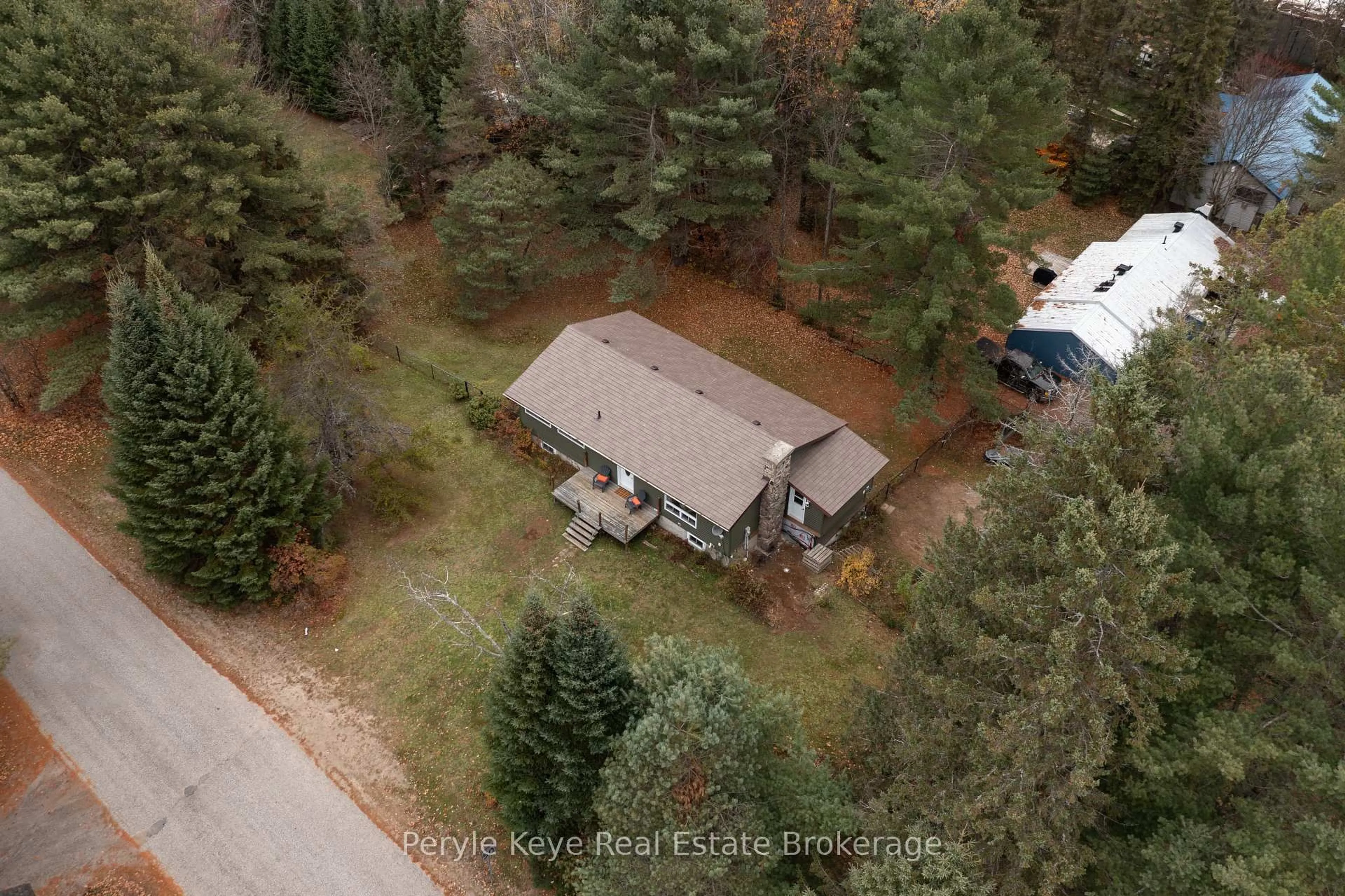 A pic from outside/outdoor area/front of a property/back of a property/a pic from drone, forest/trees view for 322 Muskoka 10 Rd, Huntsville Ontario P0B 1L0