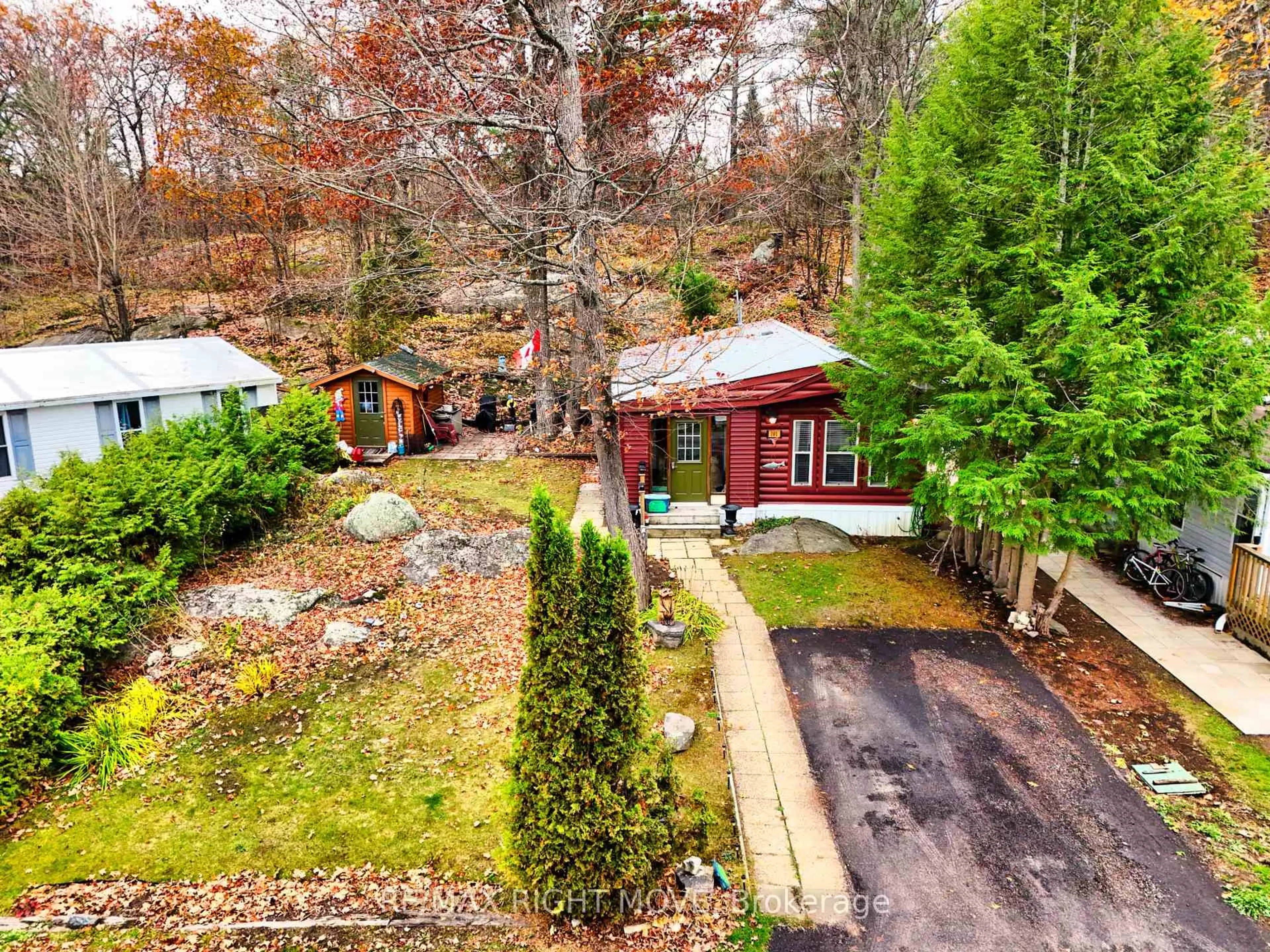 A pic from outside/outdoor area/front of a property/back of a property/a pic from drone, forest/trees view for 1007 Racoon Rd #101, Gravenhurst Ontario P1P 0C2