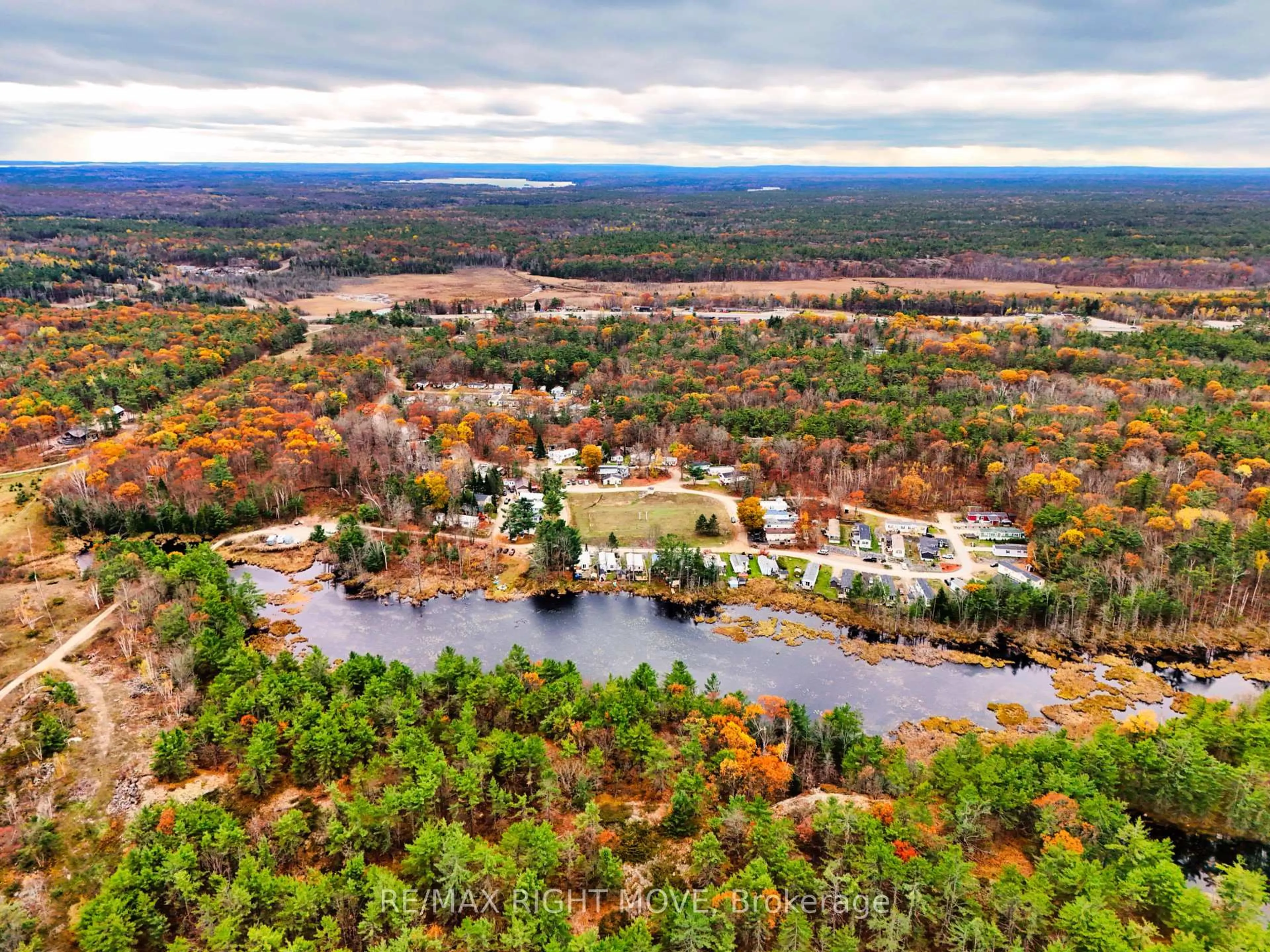 A pic from outside/outdoor area/front of a property/back of a property/a pic from drone, water/lake/river/ocean view for 1007 Racoon Rd #101, Gravenhurst Ontario P1P 0C2