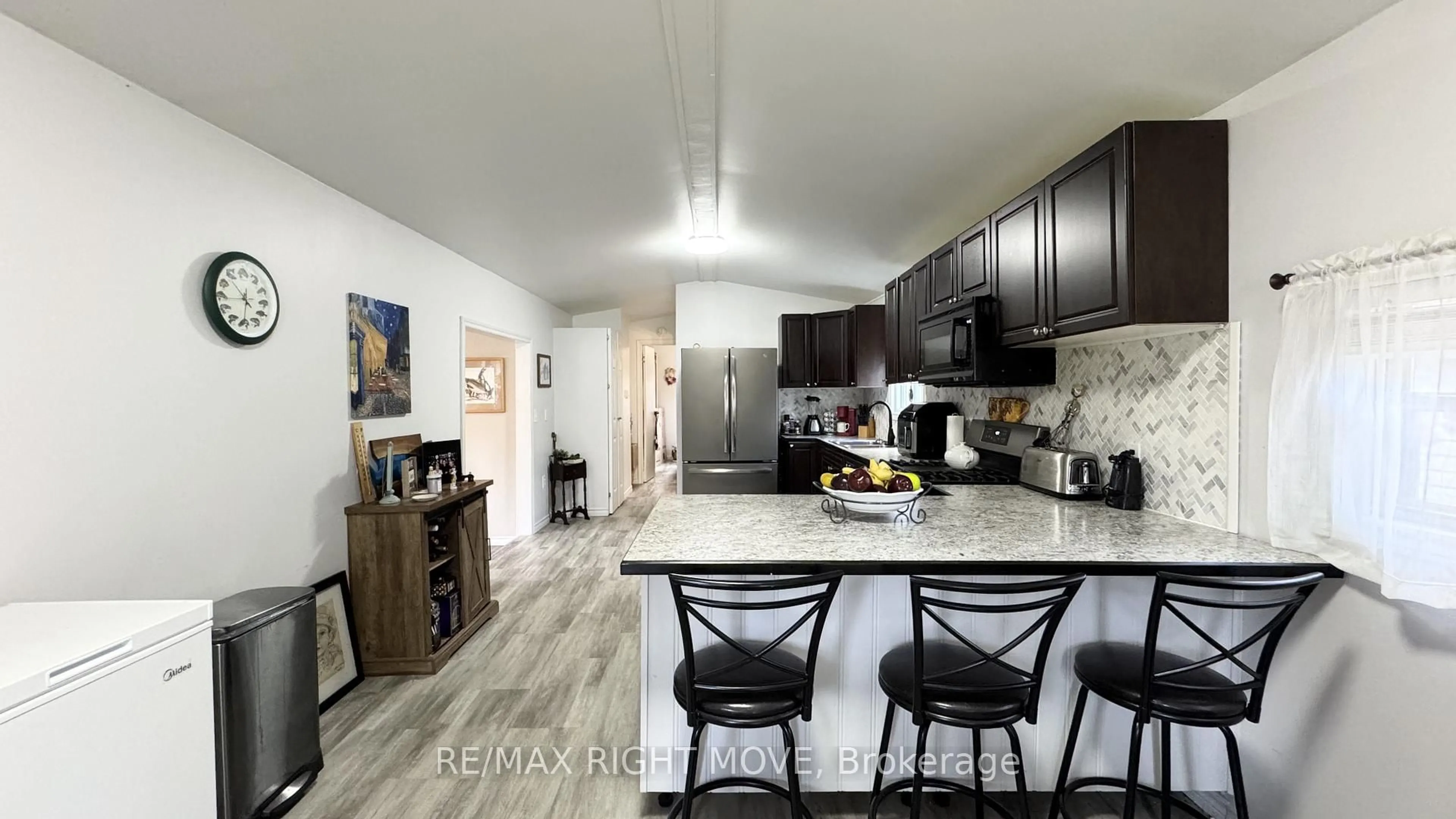 Open concept kitchen, ceramic/tile floor for 1007 Racoon Rd #101, Gravenhurst Ontario P1P 0C2