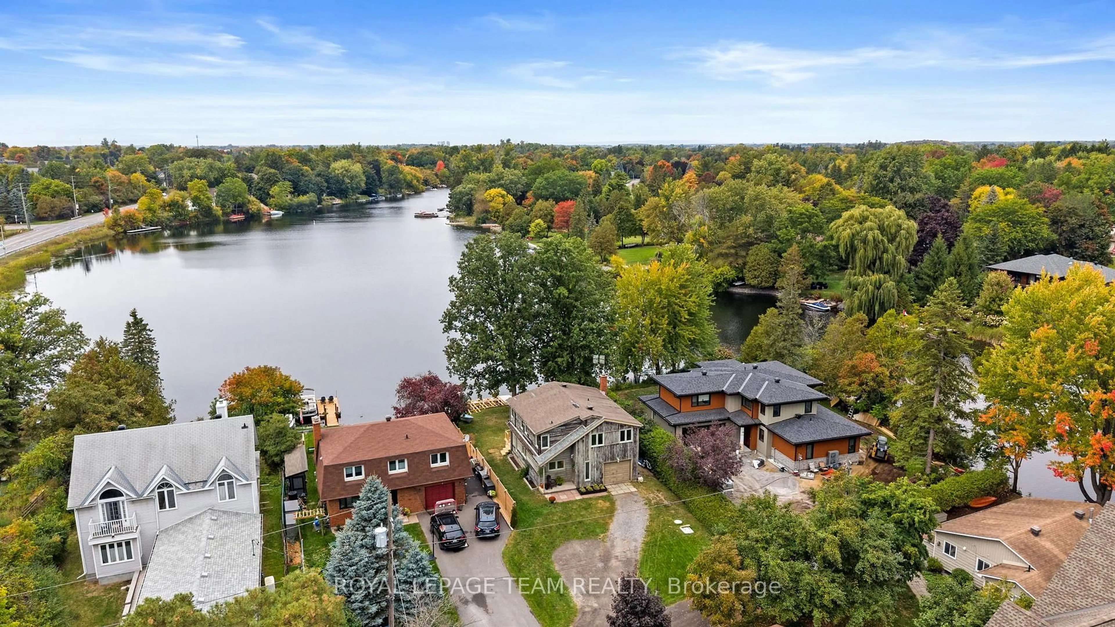 A pic from outside/outdoor area/front of a property/back of a property/a pic from drone, water/lake/river/ocean view for 1119 Firefly Lane, Manotick Ontario K4M 0T6