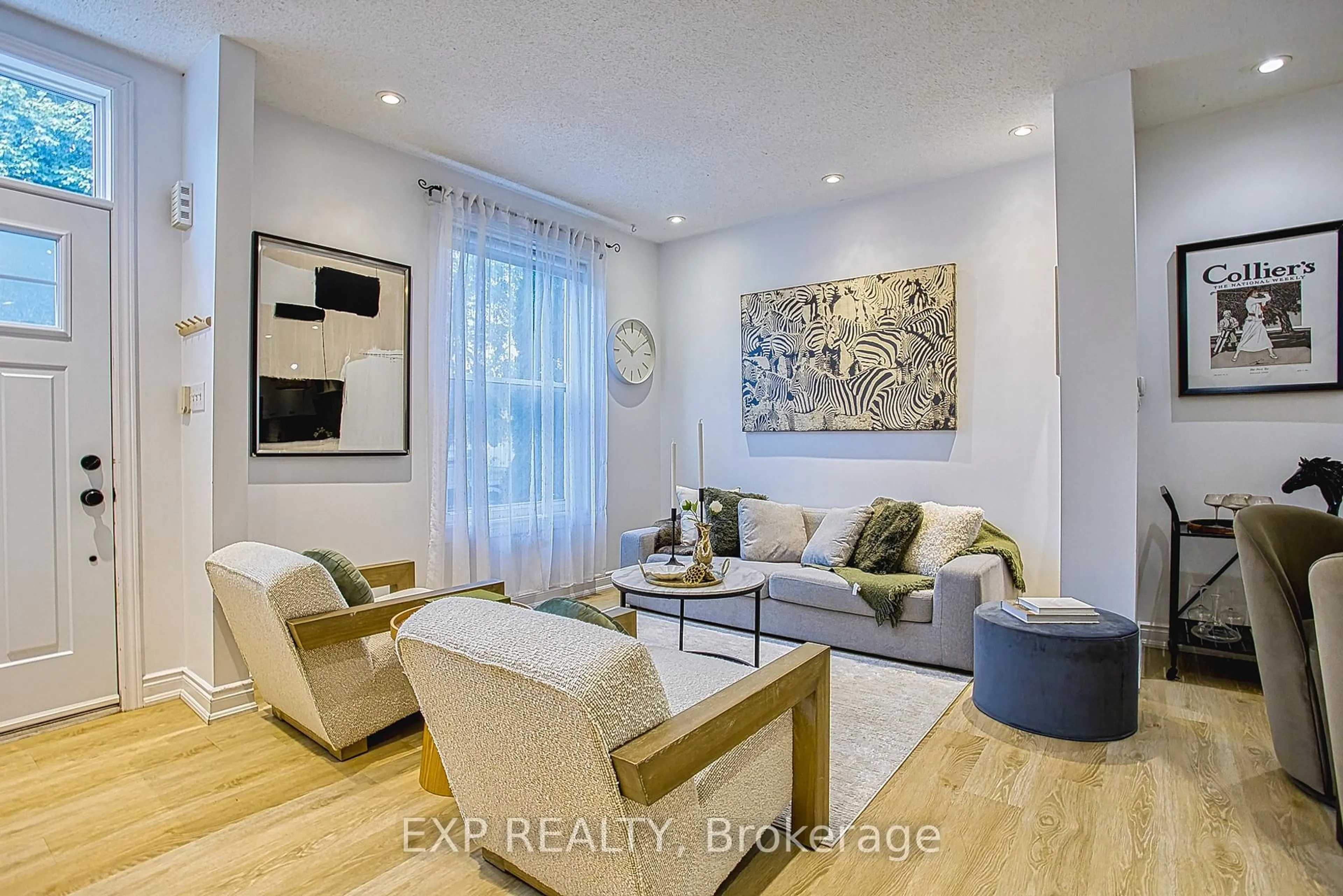 Living room with furniture, wood/laminate floor for 82 Ashley St, Hamilton Ontario L8L 5T1