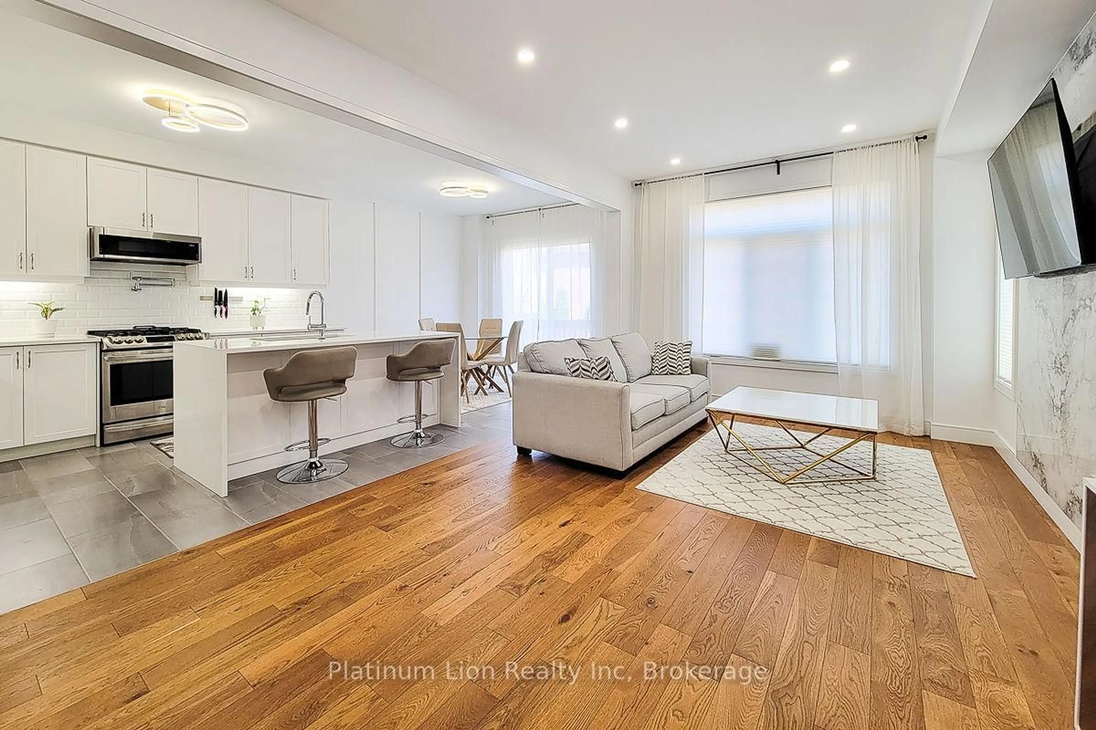 Living room with furniture, wood/laminate floor for 87 Mcknight Ave, Hamilton Ontario L8B 0T8