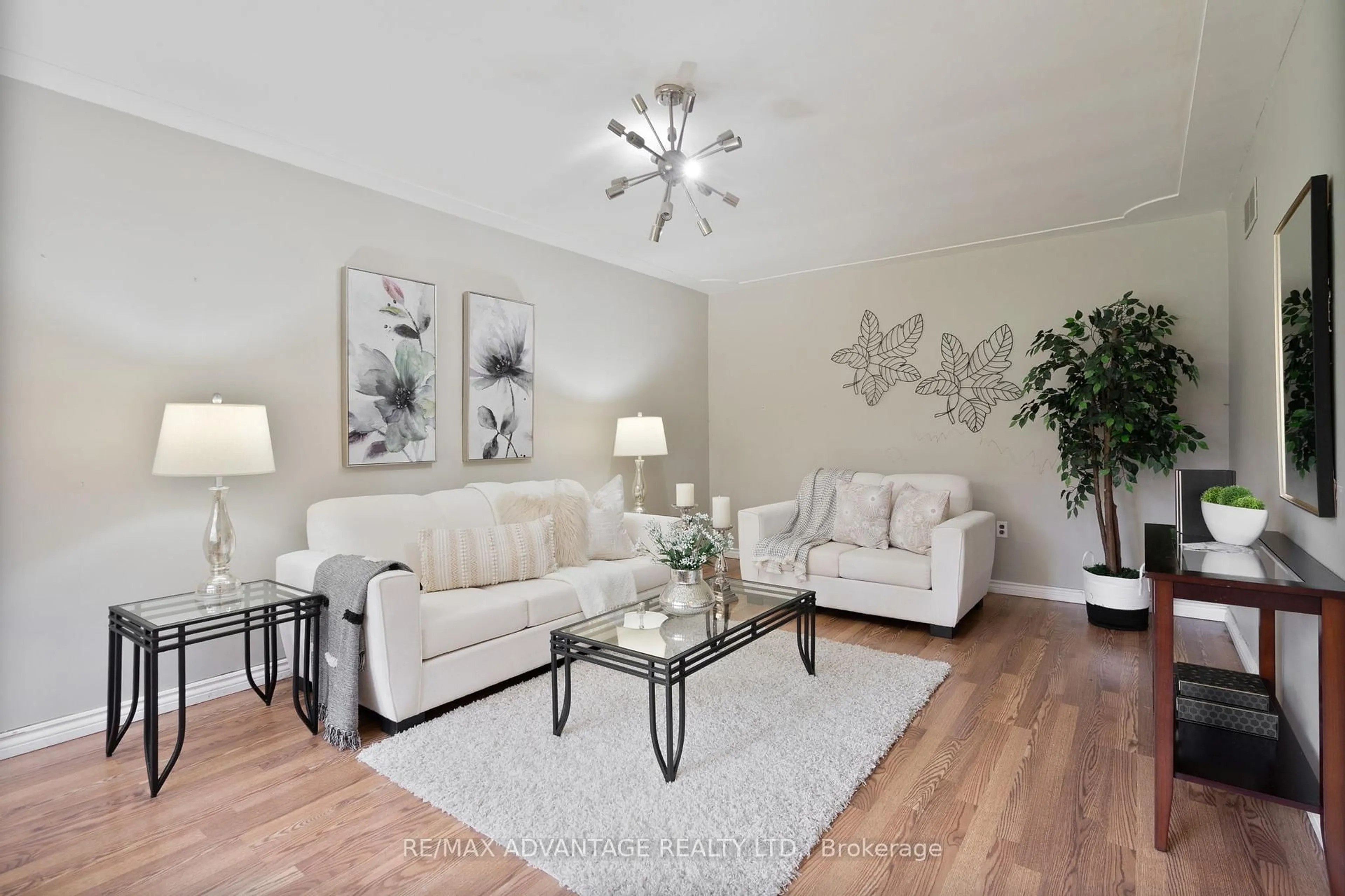 Living room with furniture, wood/laminate floor for 464 Three Valleys Cres, London South Ontario N5Z 3E7