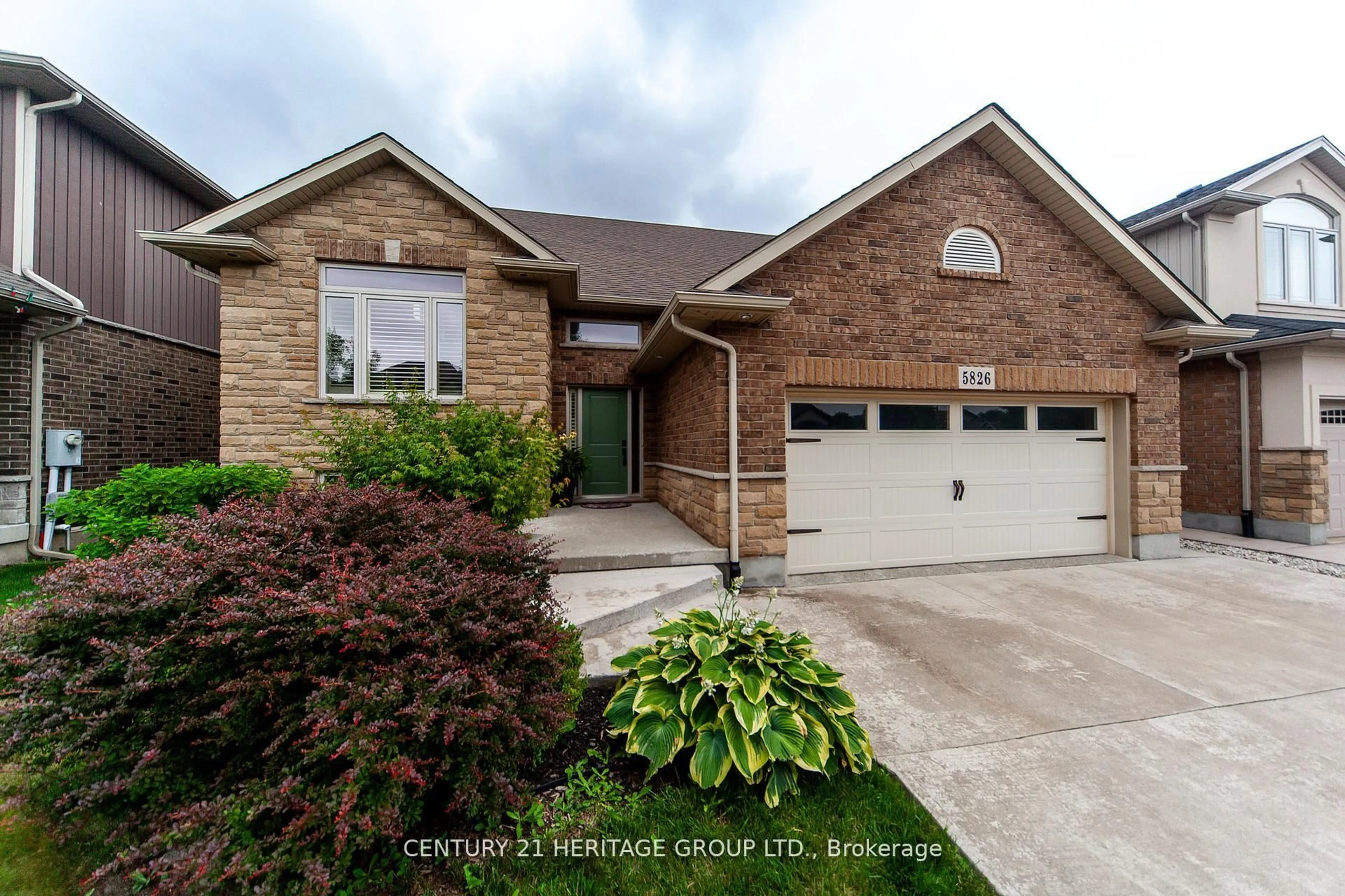 Home with brick exterior material, street for 5826 Fiddlehead Lane, Niagara Falls Ontario L2H 0E9