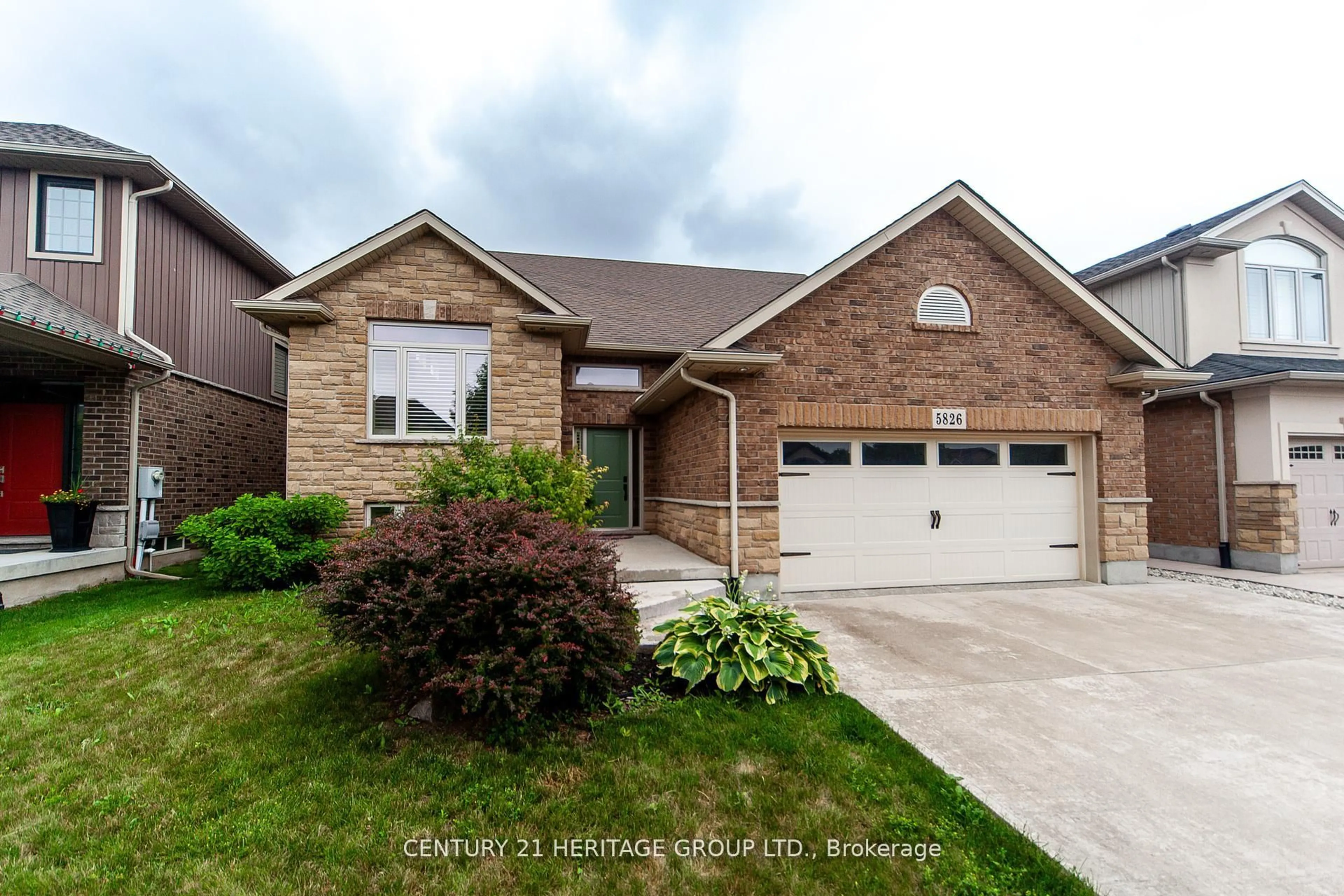 Home with brick exterior material, street for 5826 Fiddlehead Lane, Niagara Falls Ontario L2H 0E9