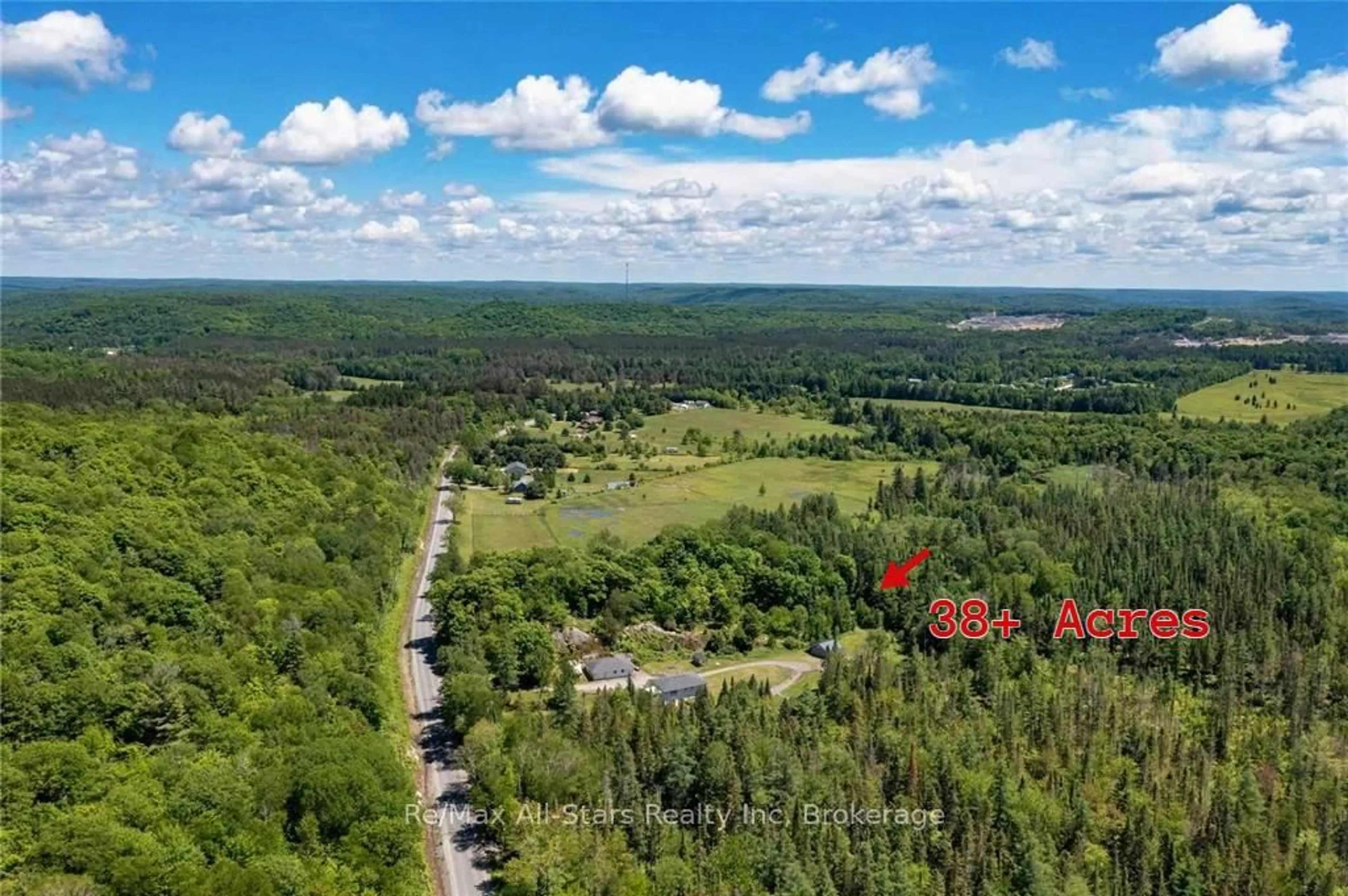 A pic from outside/outdoor area/front of a property/back of a property/a pic from drone, forest/trees view for 410 Etwell Rd, Huntsville Ontario P1H 2J2