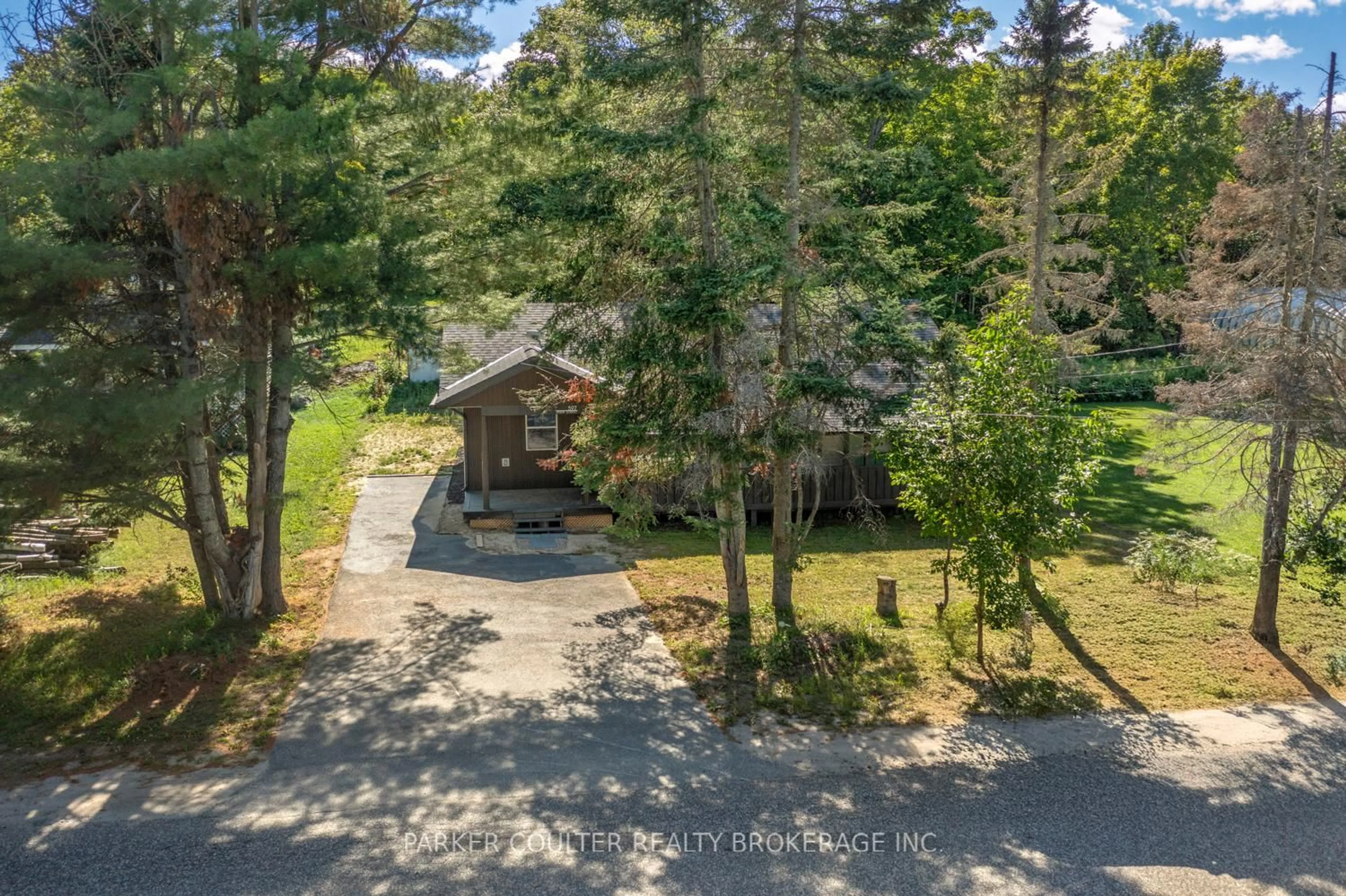 A pic from outside/outdoor area/front of a property/back of a property/a pic from drone, forest/trees view for 597 High St, Georgian Bay Ontario P0C 1H0