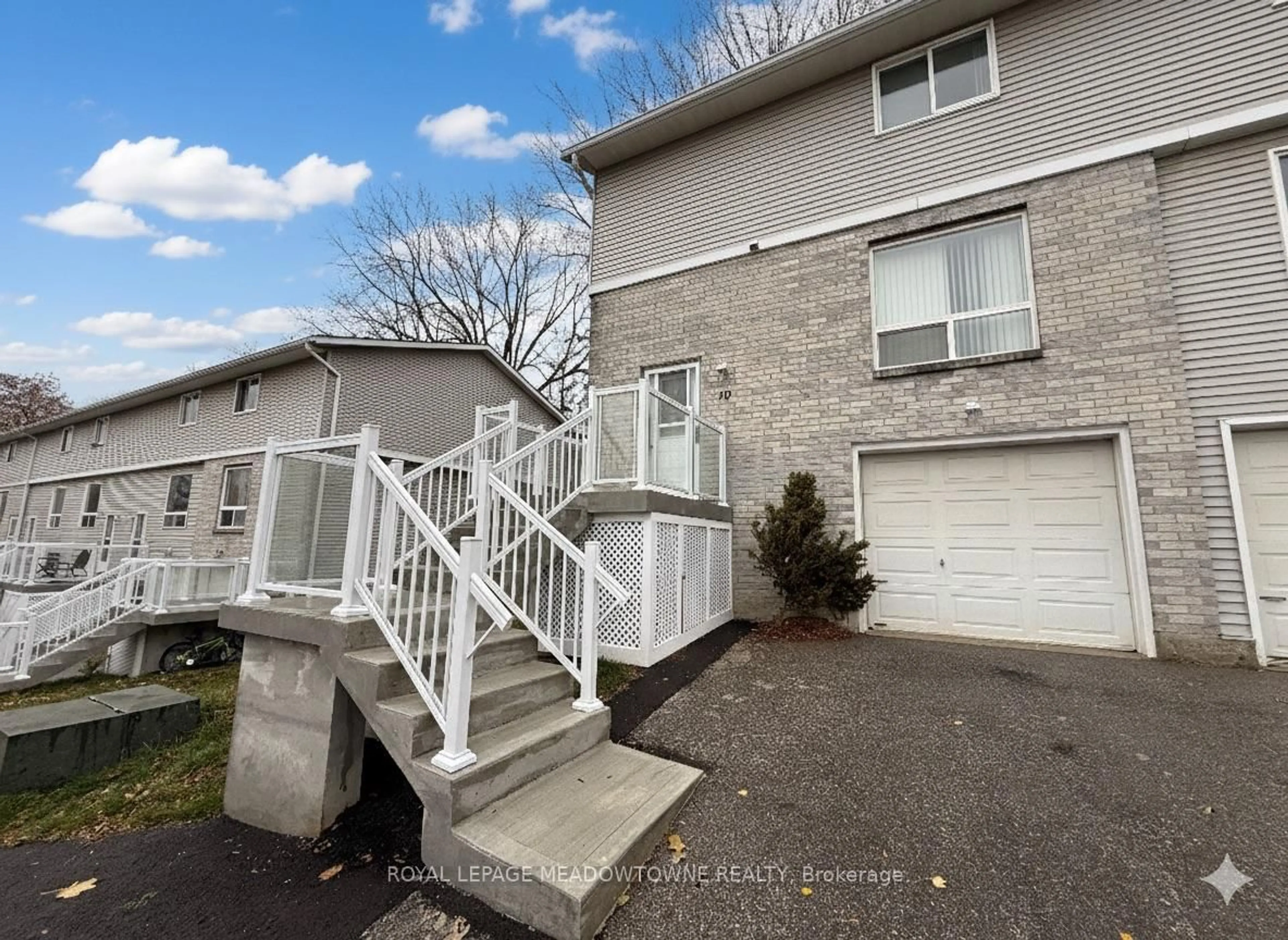 A pic from outside/outdoor area/front of a property/back of a property/a pic from drone, street for 648 Doon Village Rd #10, Kitchener Ontario N2P 1A2