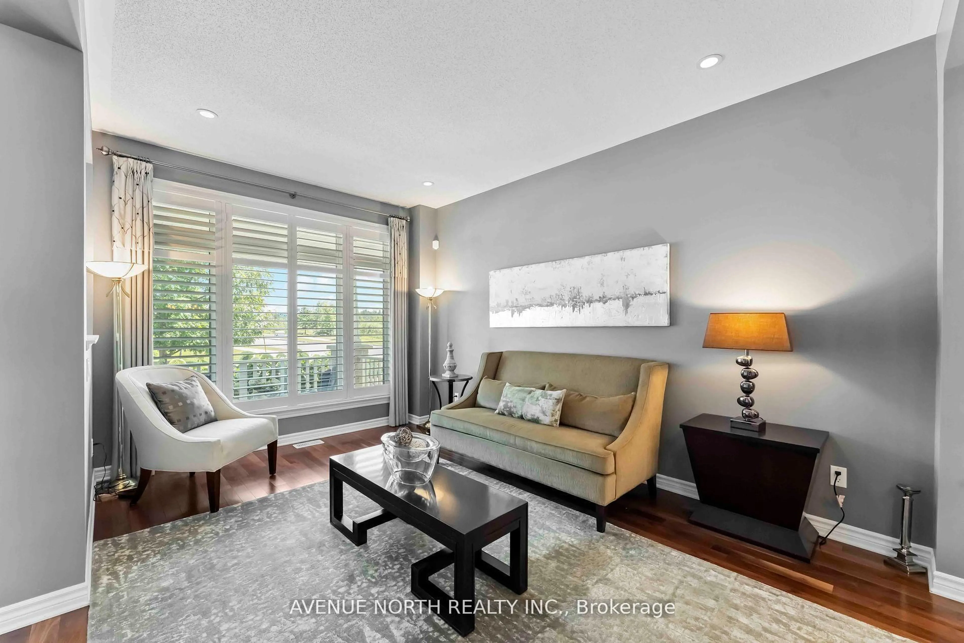 Living room with furniture, wood/laminate floor for 714 BUNCHBERRY Way, Ottawa Ontario K1T 0J8