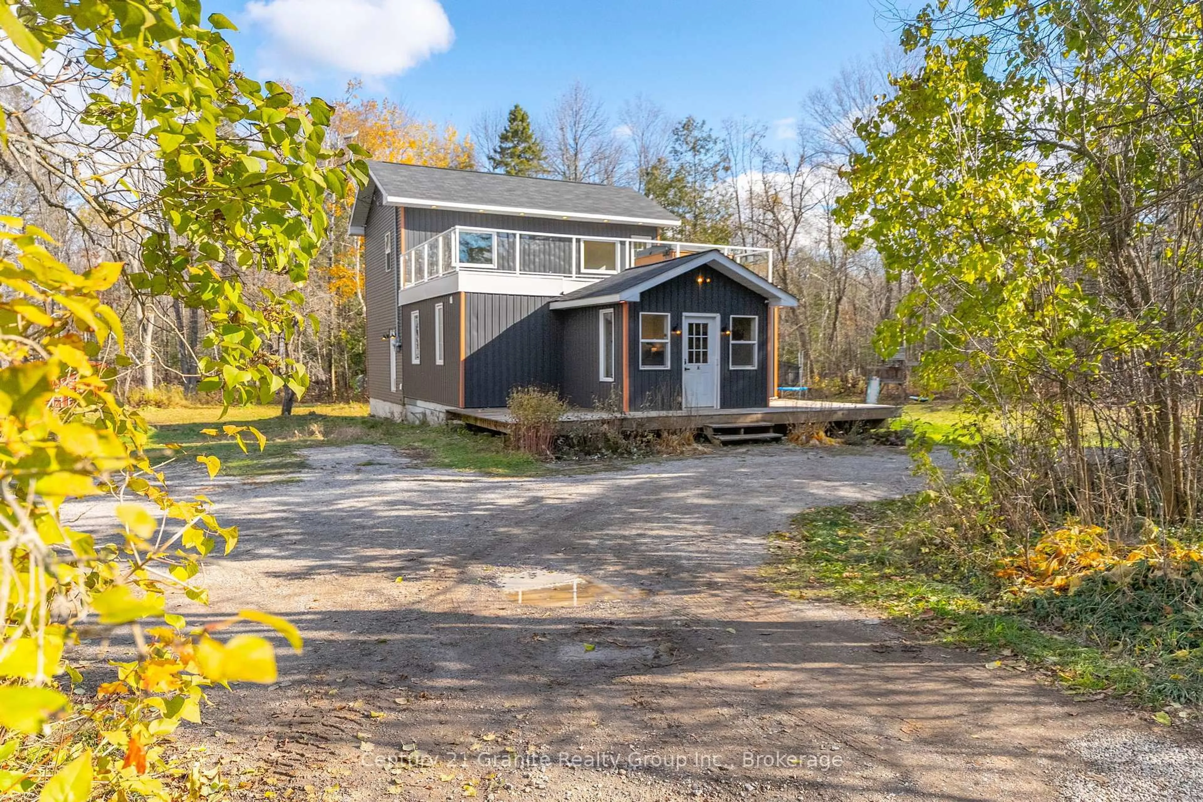 A pic from outside/outdoor area/front of a property/back of a property/a pic from drone, street for 1126 Rice Rd, Minden Hills Ontario K0M 2K0