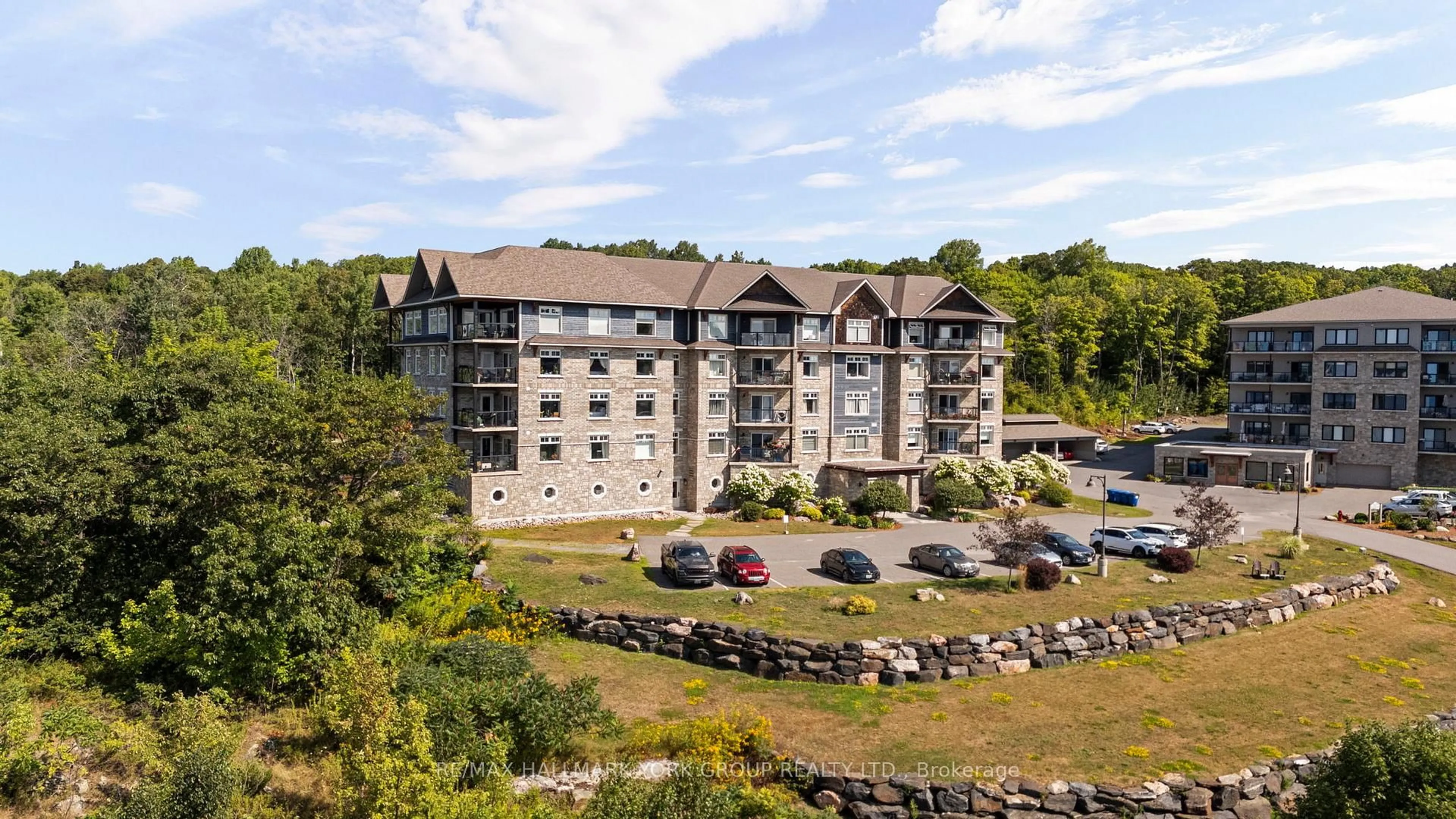 A pic from outside/outdoor area/front of a property/back of a property/a pic from drone, unknown for 11A Salt Dock Rd #202, Parry Sound Ontario P2A 3B6