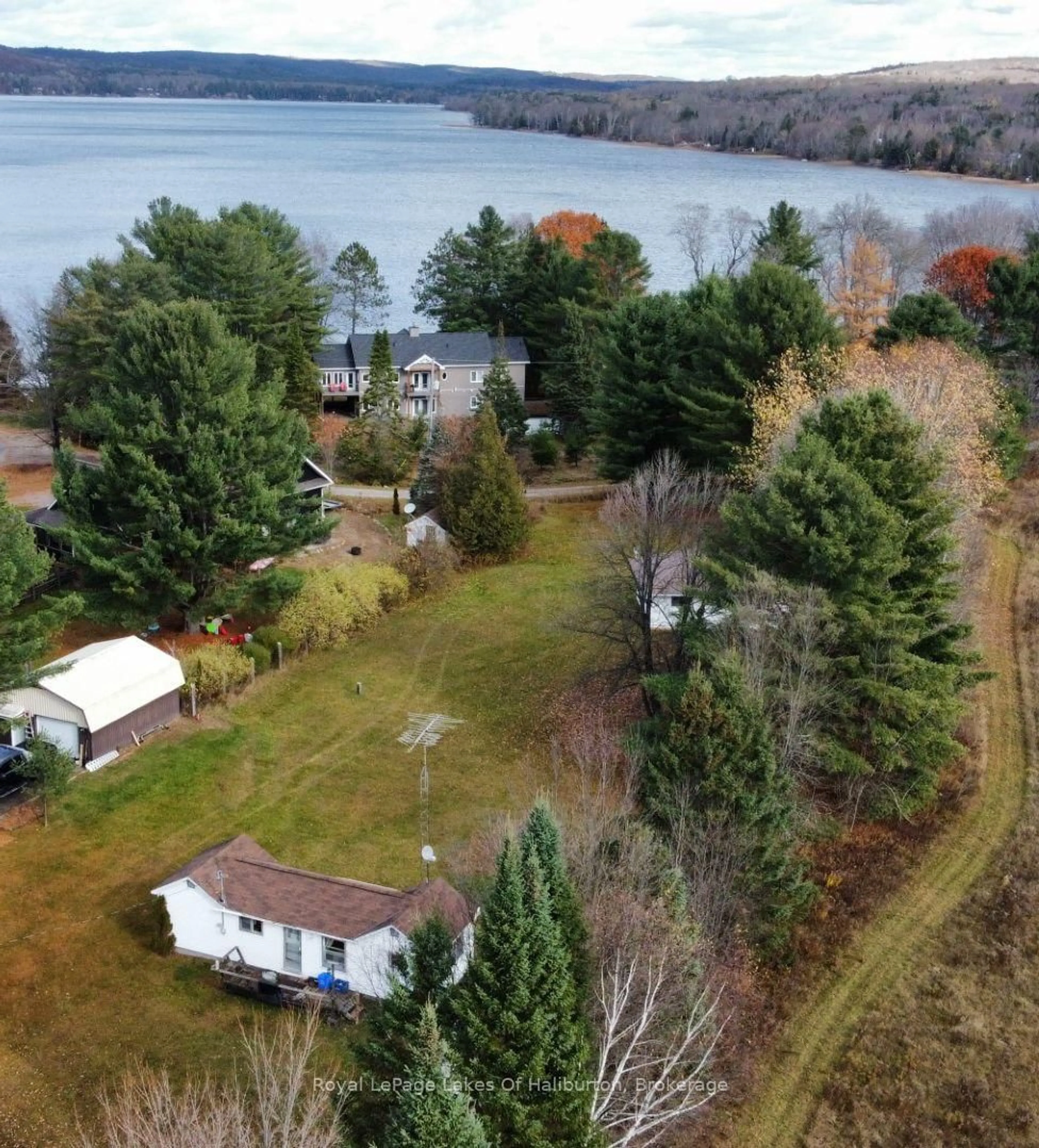 A pic from outside/outdoor area/front of a property/back of a property/a pic from drone, water/lake/river/ocean view for 1080 St. Peter's Rd, Algonquin Highlands Ontario K0M 1S0