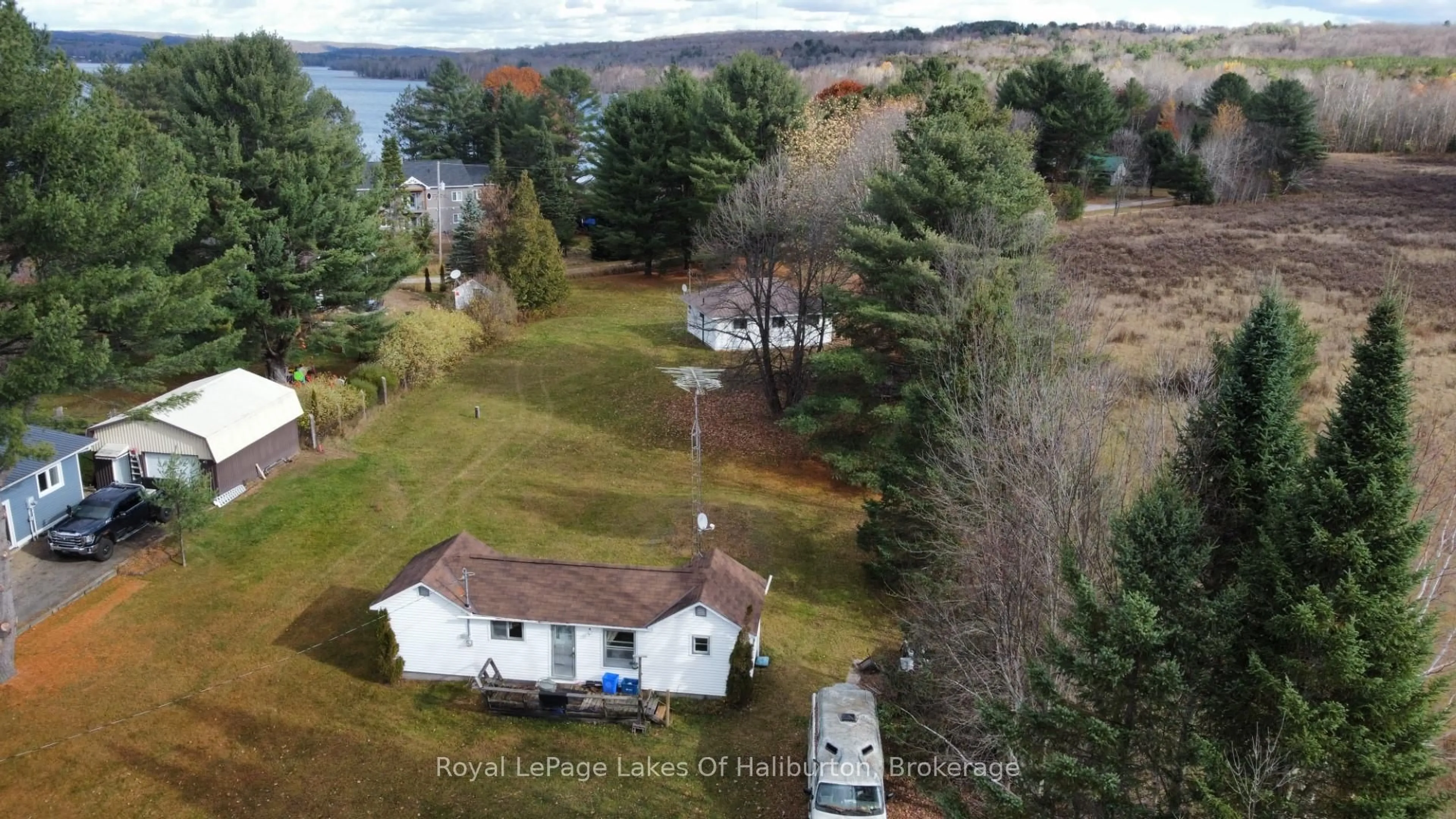 A pic from outside/outdoor area/front of a property/back of a property/a pic from drone, water/lake/river/ocean view for 1080 St. Peter's Rd, Algonquin Highlands Ontario K0M 1S0