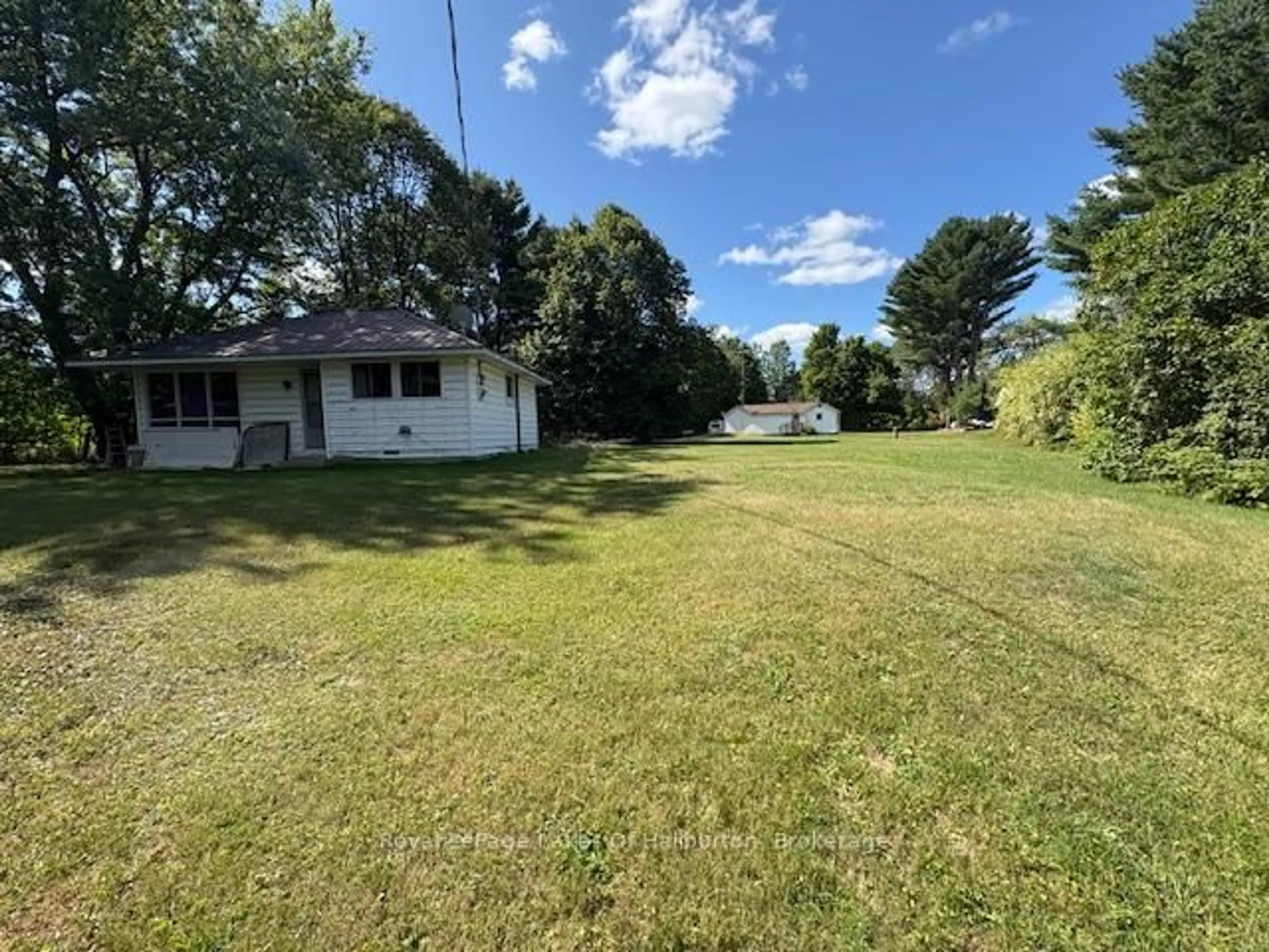 A pic from outside/outdoor area/front of a property/back of a property/a pic from drone, water/lake/river/ocean view for 1080 St. Peter's Rd, Algonquin Highlands Ontario K0M 1S0