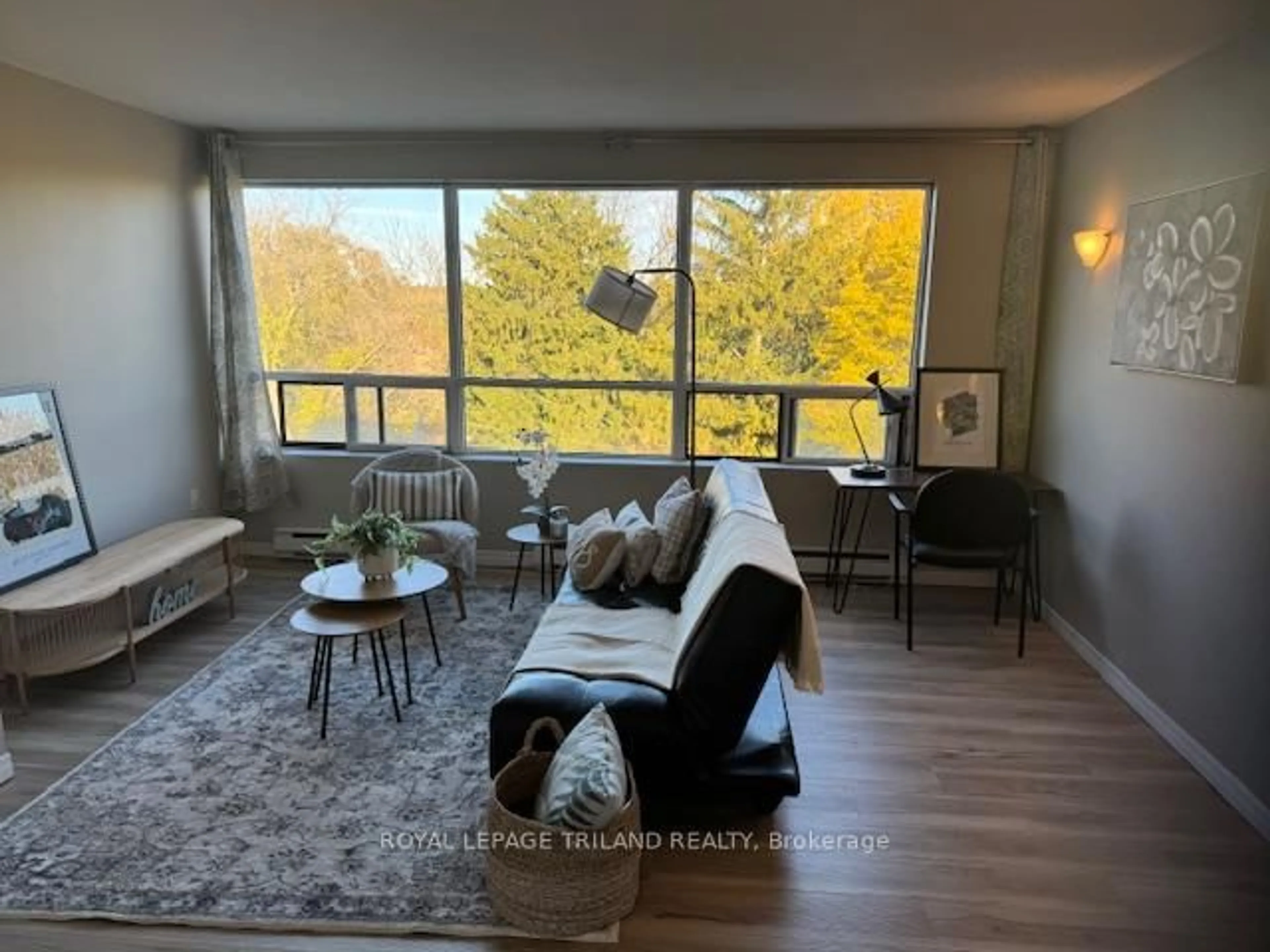 Living room with furniture, wood/laminate floor for 650 Cheapside St #605, London East Ontario N5Y 5J8