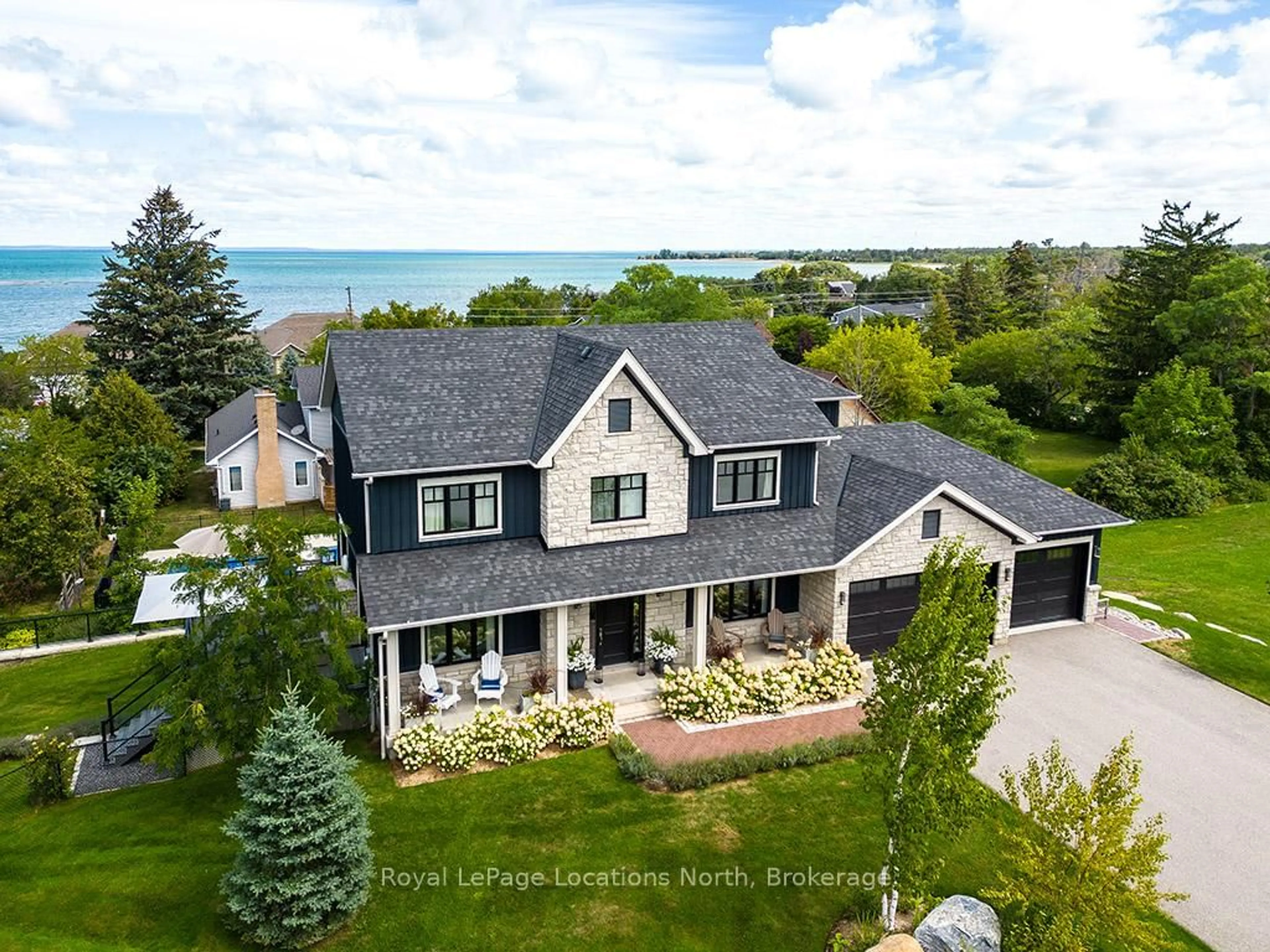 A pic from outside/outdoor area/front of a property/back of a property/a pic from drone, water/lake/river/ocean view for 117 SCHOOLHOUSE Crt, Blue Mountains Ontario L9Y 0N2