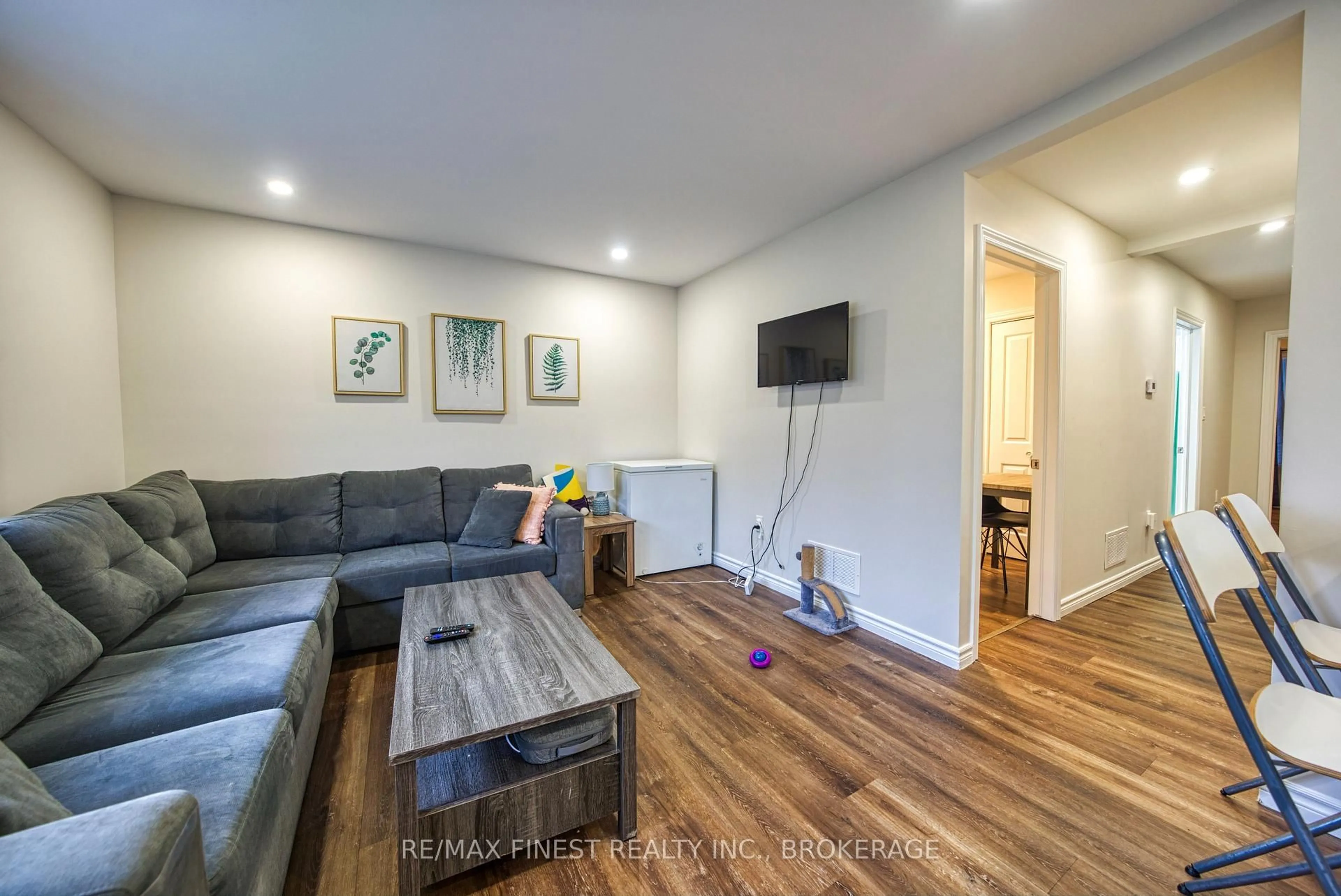 Living room with furniture, wood/laminate floor for 430 Macdonnell St, Kingston Ontario K7L 4E4