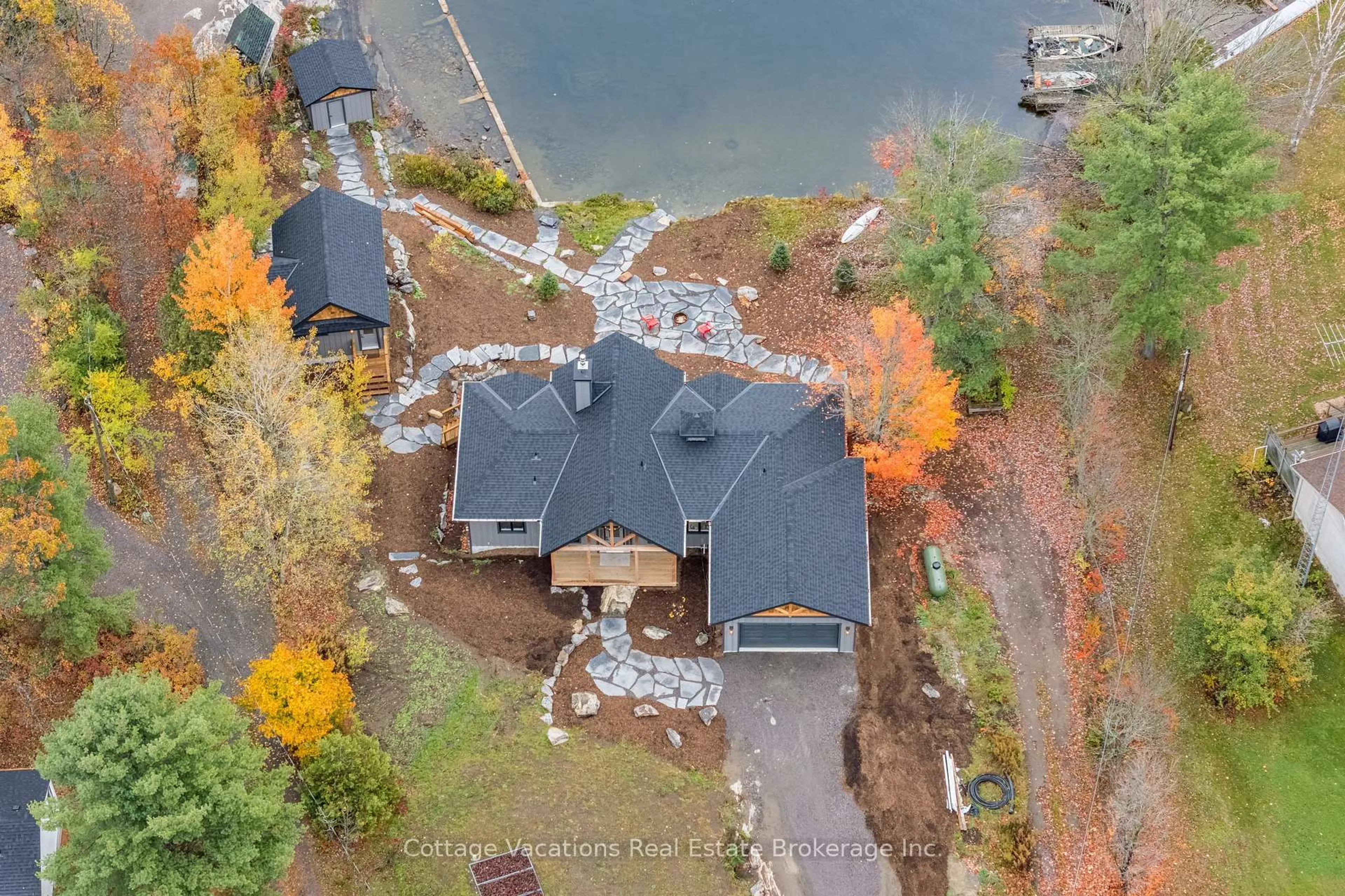 A pic from outside/outdoor area/front of a property/back of a property/a pic from drone, water/lake/river/ocean view for 1111 Lakeshore Dr, Gravenhurst Ontario P1P 1R2