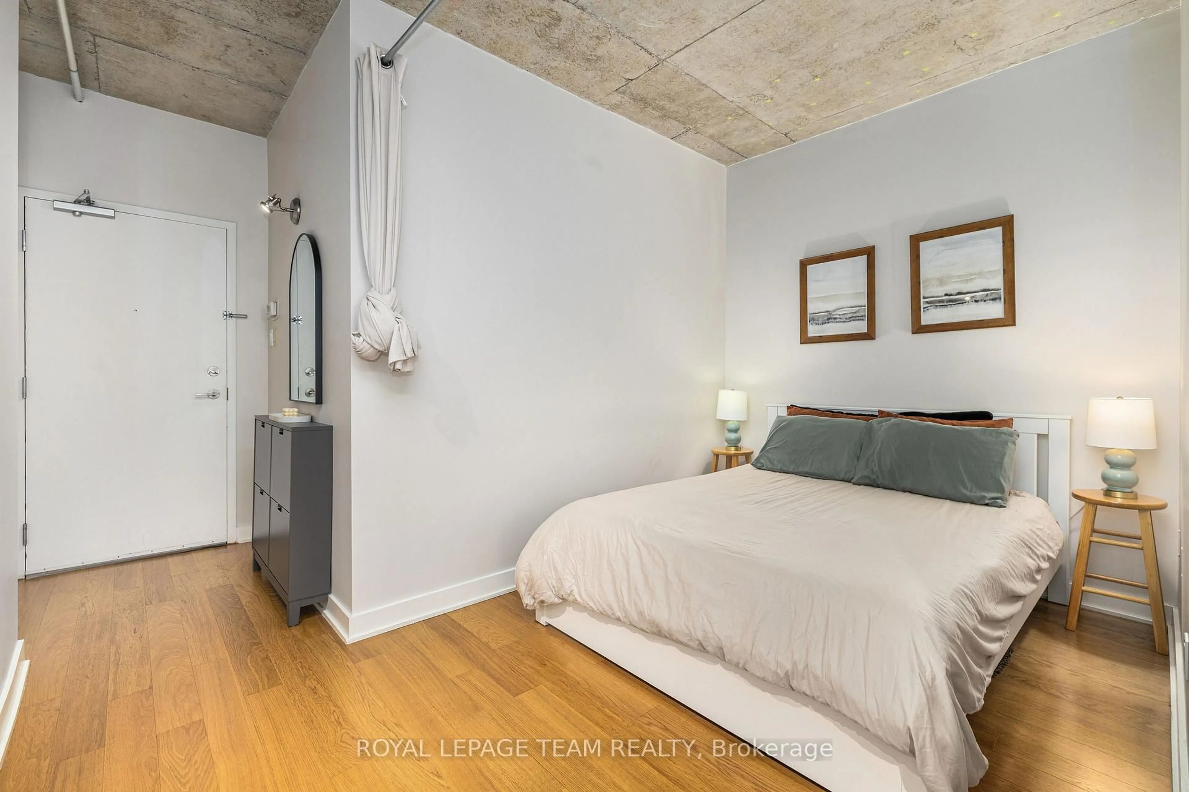 Bedroom with bed, cement floor for 354 Gladstone Ave #608, Ottawa Ontario K2P 0R4