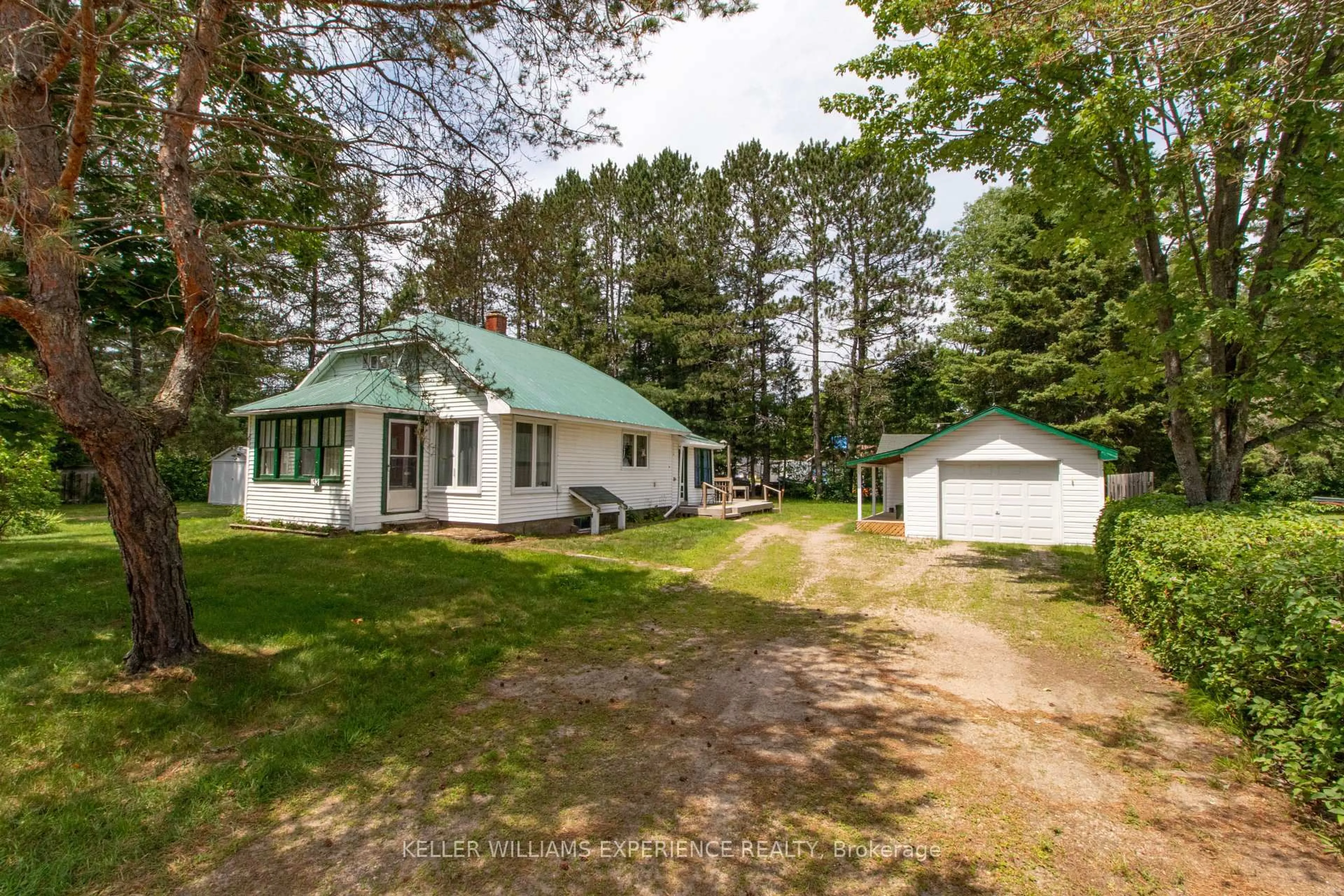 A pic from outside/outdoor area/front of a property/back of a property/a pic from drone, unknown for 152 Ottawa Ave, South River Ontario P0A 1X0