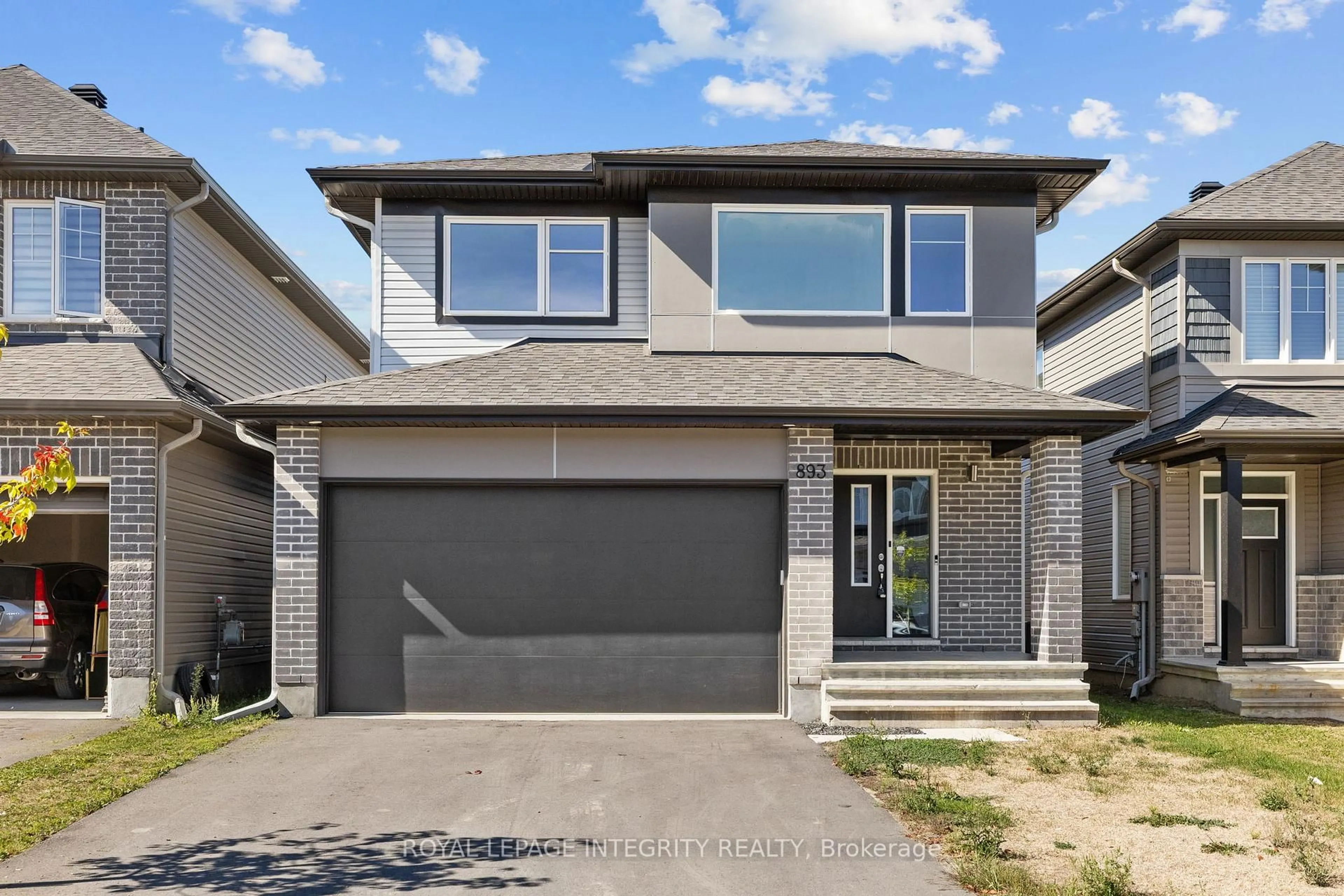 Home with brick exterior material, street for 893 Sendero Way, Stittsville Ontario K2S 2W8