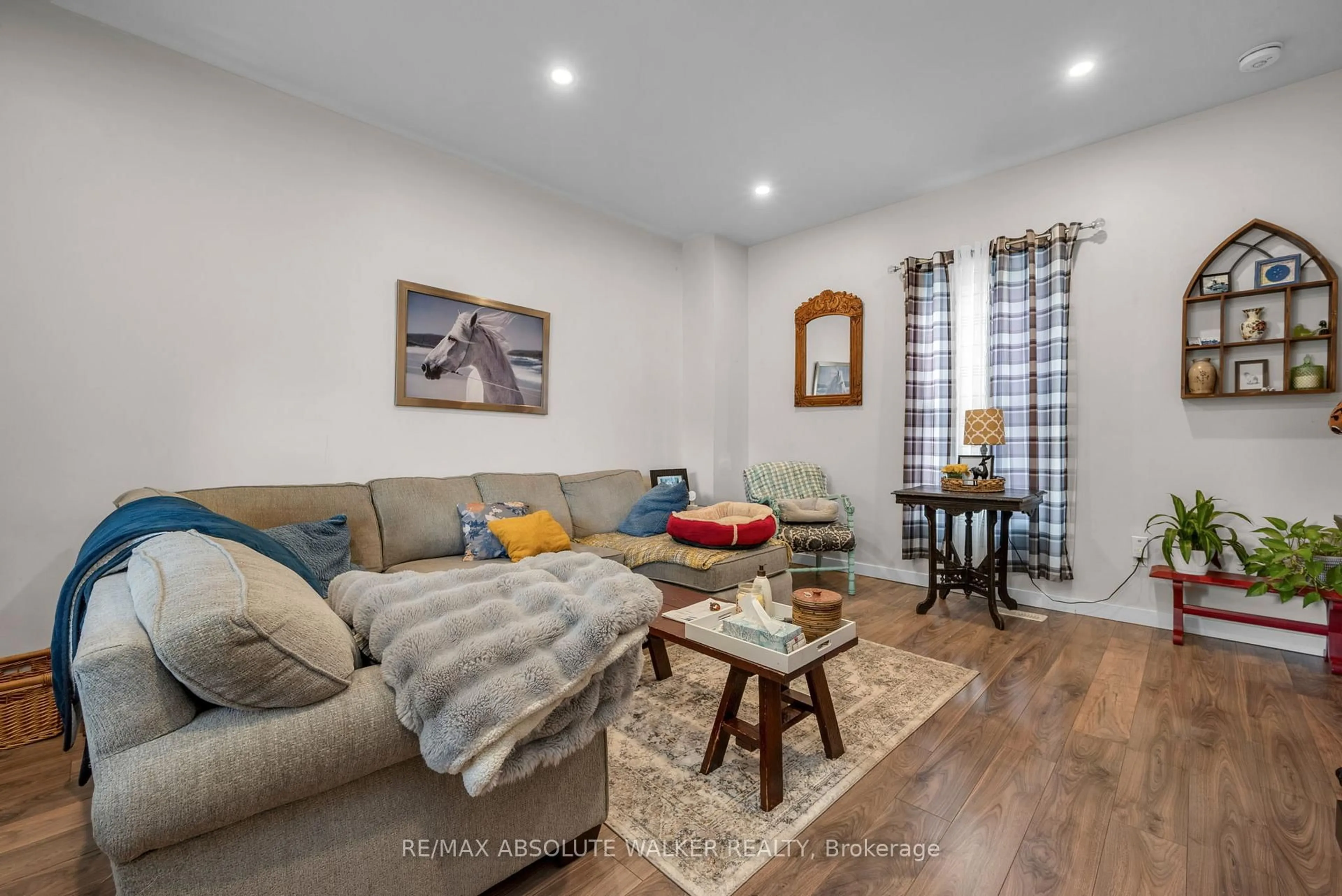 Living room with furniture, wood/laminate floor for 321 Wood St, Prescott Ontario K0E 1T0