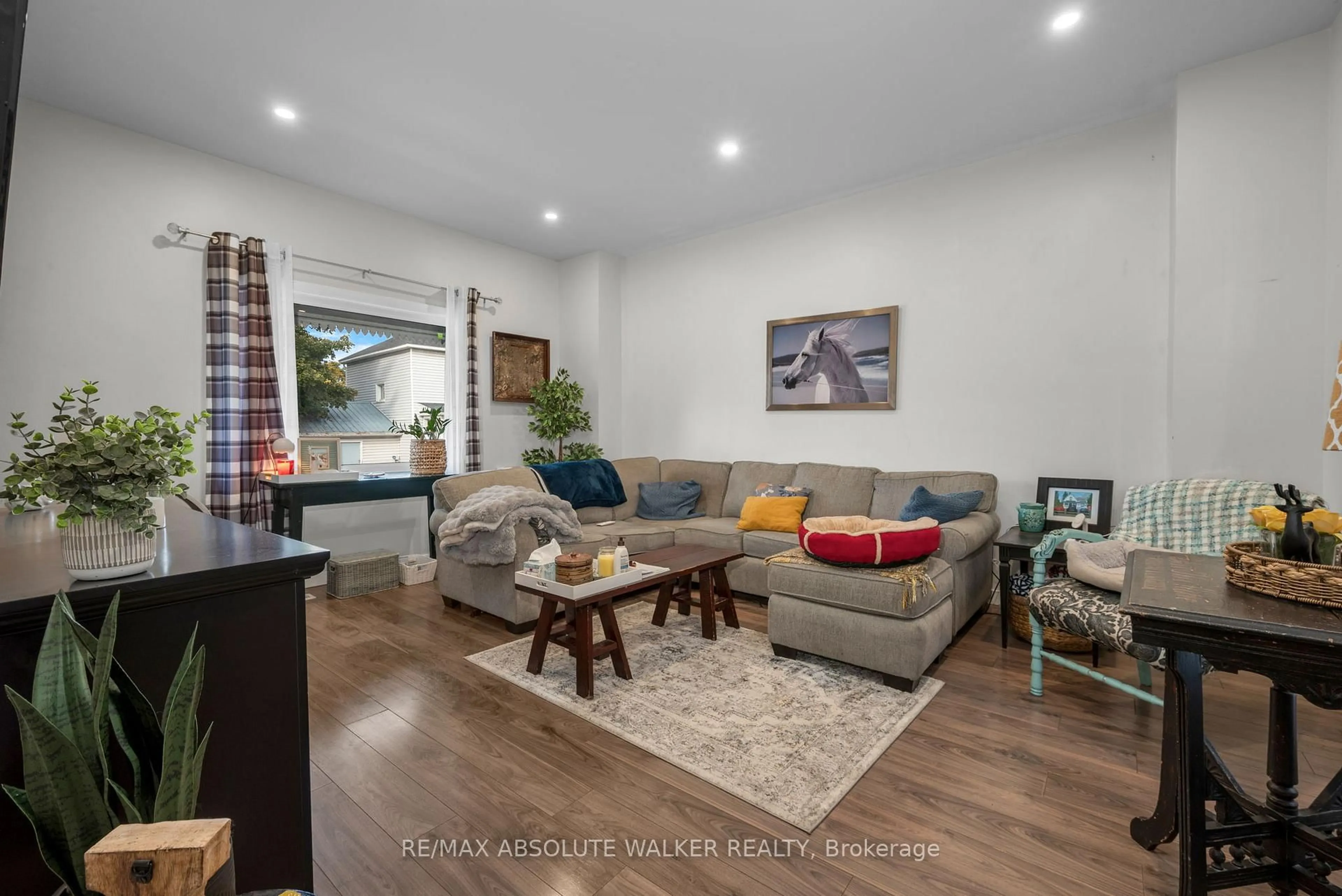 Living room with furniture, wood/laminate floor for 321 Wood St, Prescott Ontario K0E 1T0