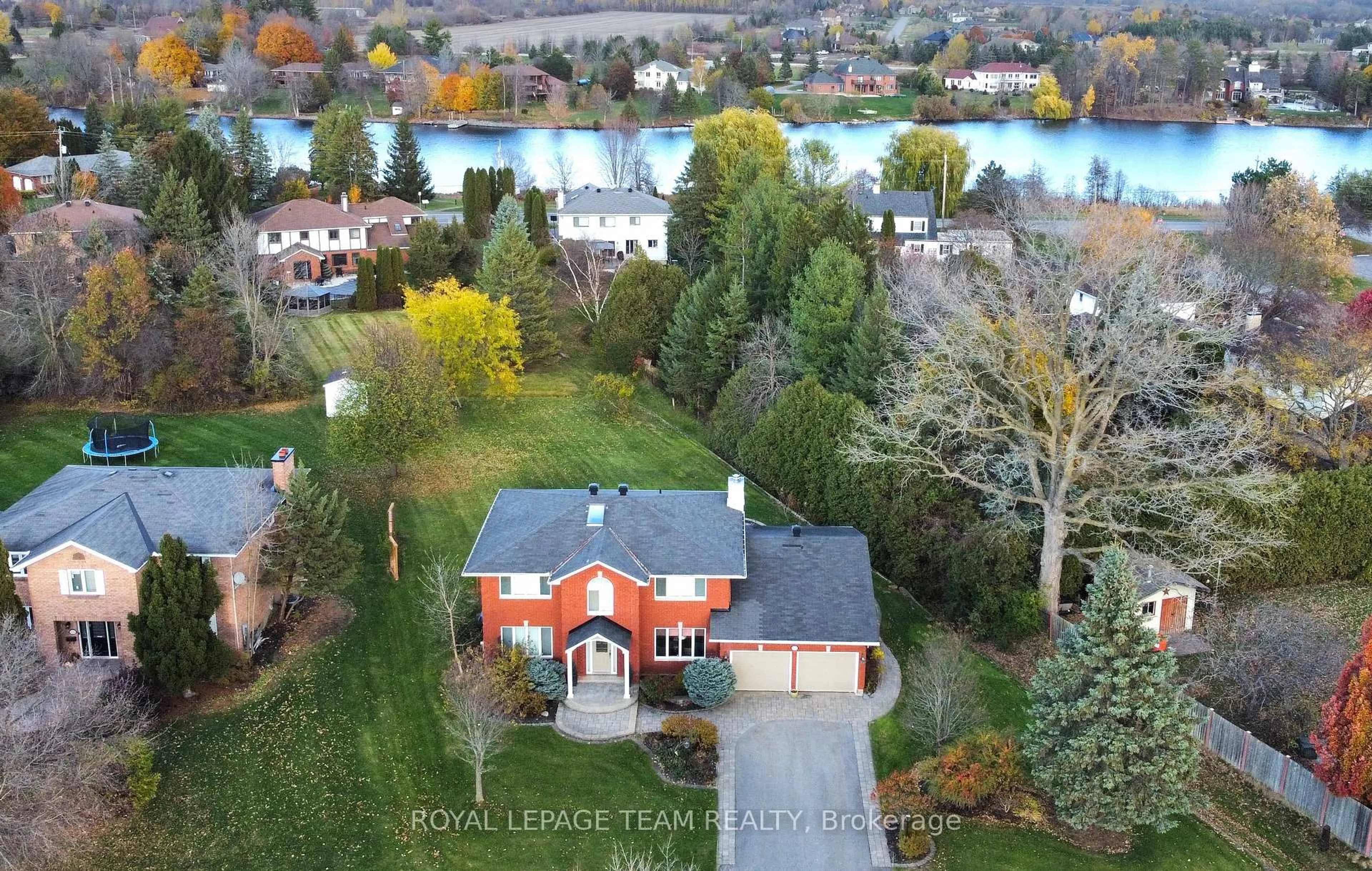 A pic from outside/outdoor area/front of a property/back of a property/a pic from drone, water/lake/river/ocean view for 1105 CINDY HILL Cres, Ottawa Ontario K4M 1E8