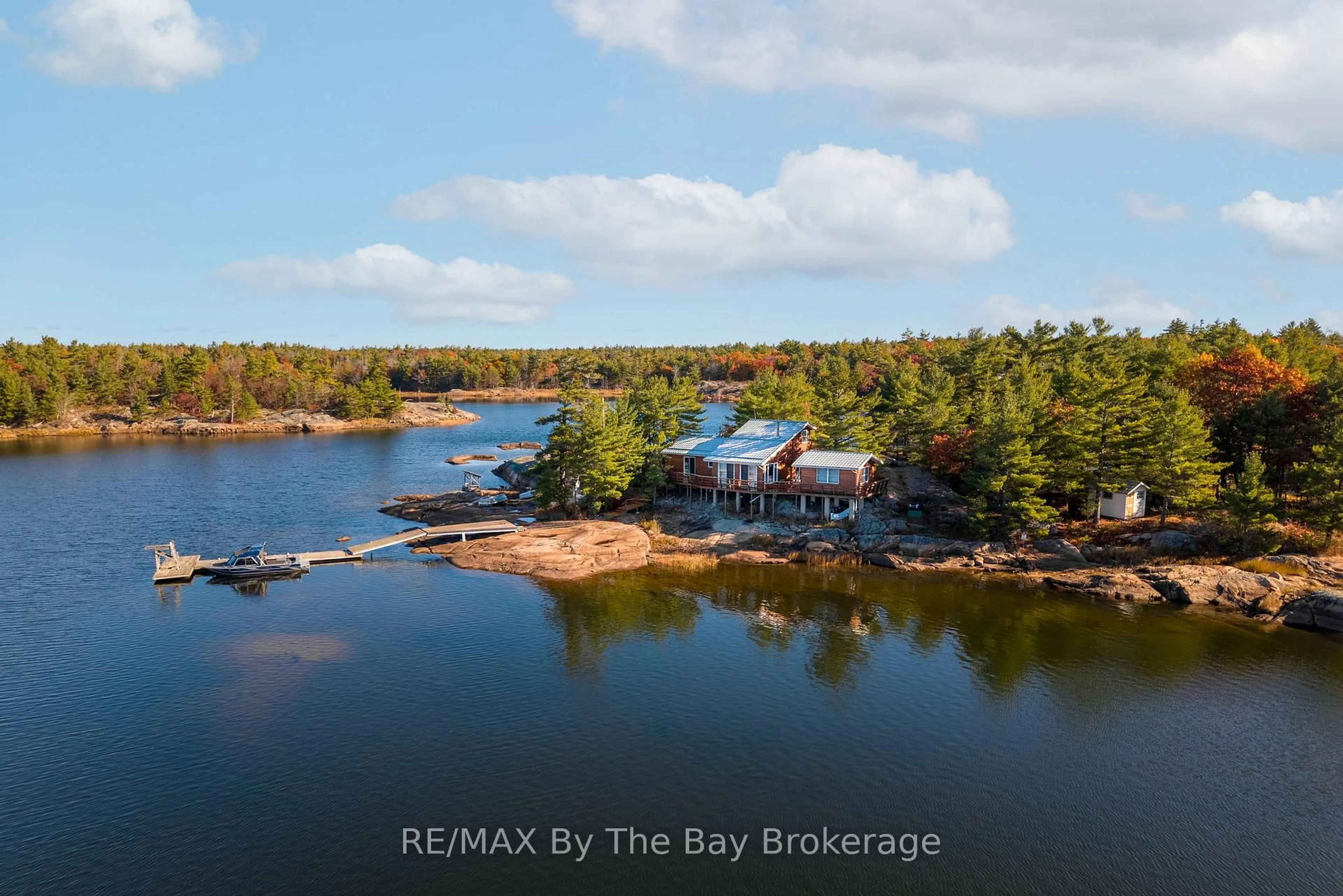 A pic from outside/outdoor area/front of a property/back of a property/a pic from drone, water/lake/river/ocean view for 2 Island 2890, Georgian Bay Ontario P0E 1E0