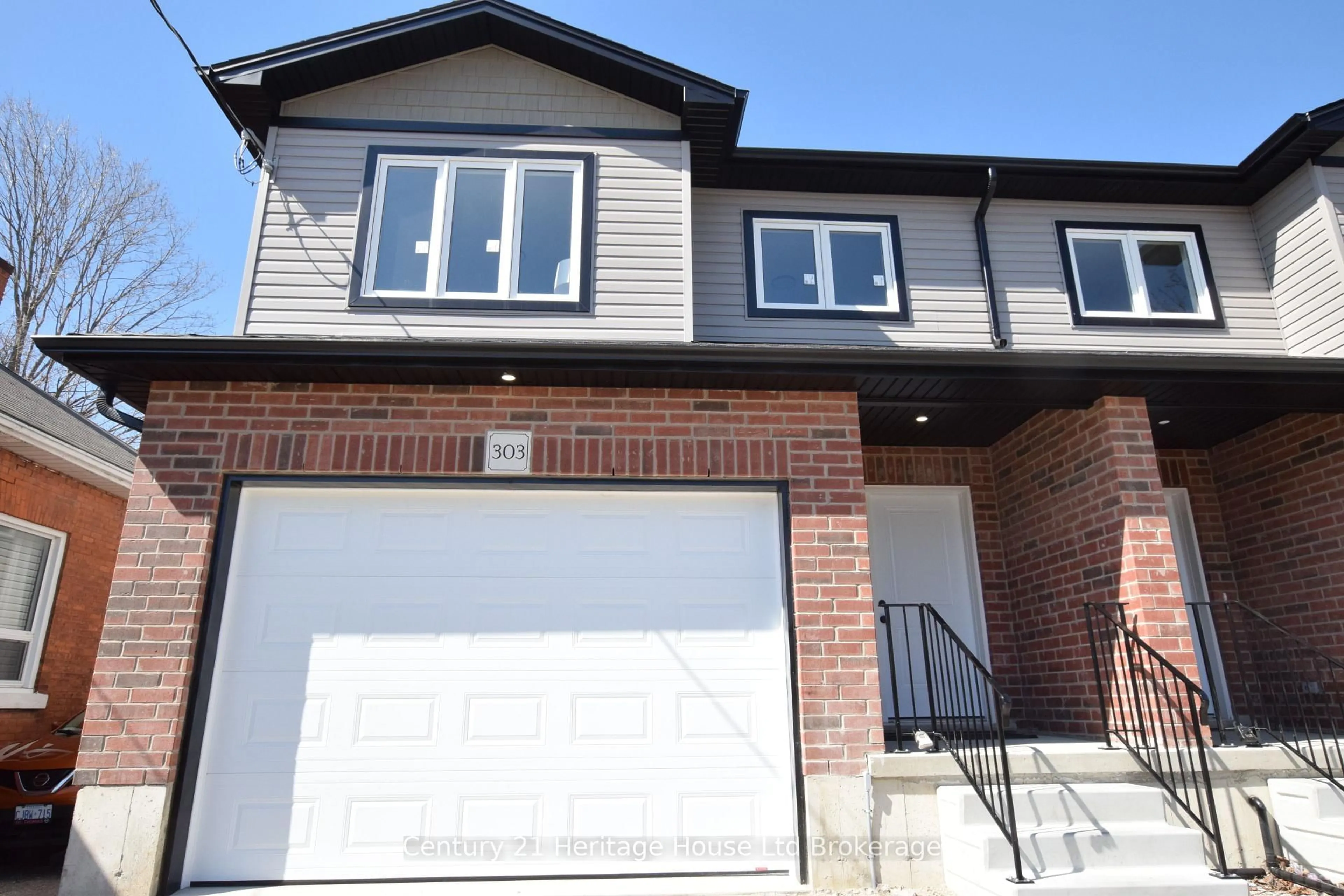 Home with brick exterior material, street for 303 Simcoe St, Woodstock Ontario N4S 1J1