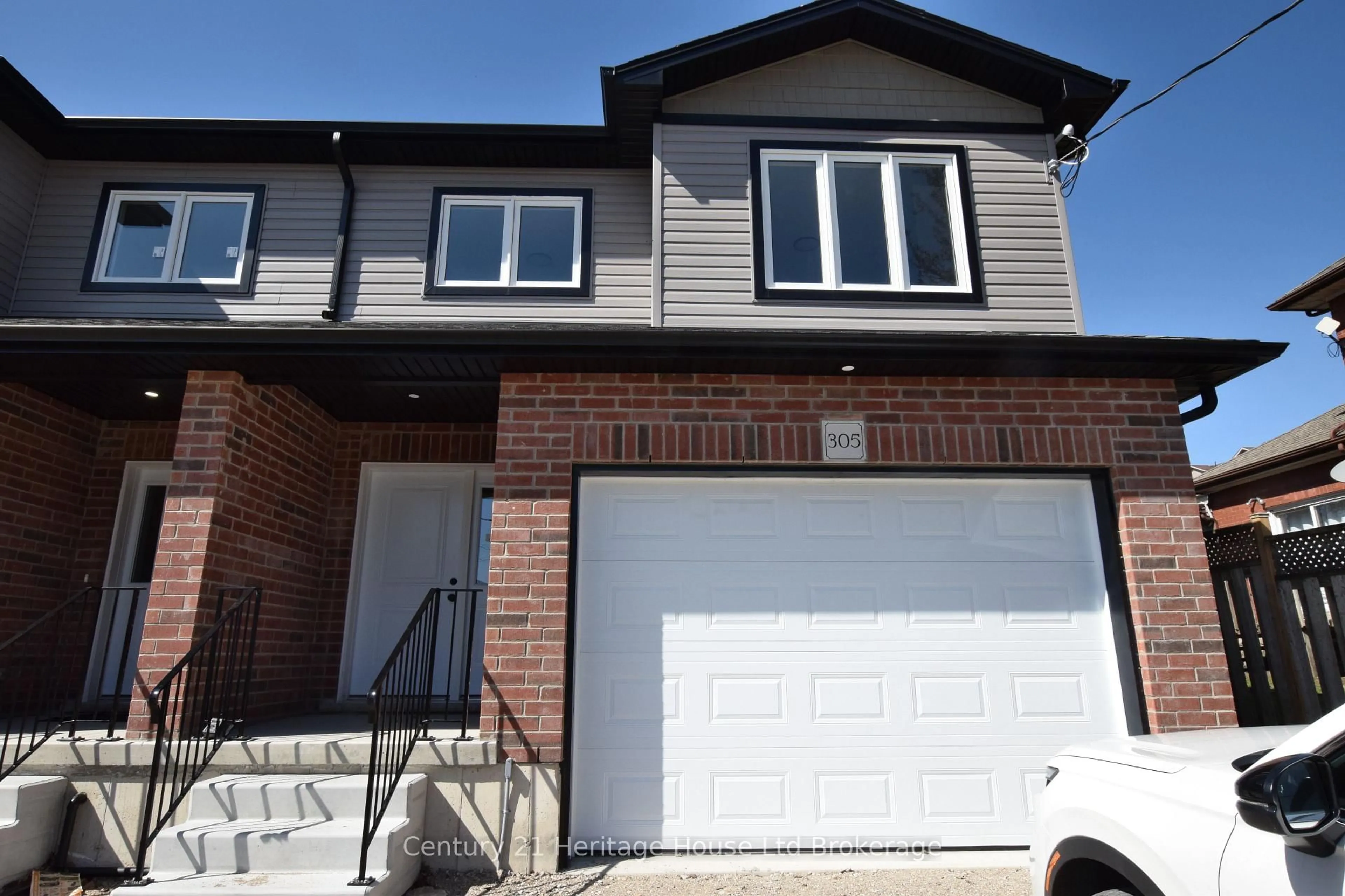 Home with brick exterior material, street for 305 SIMCOE St, Woodstock Ontario N4S 1J1