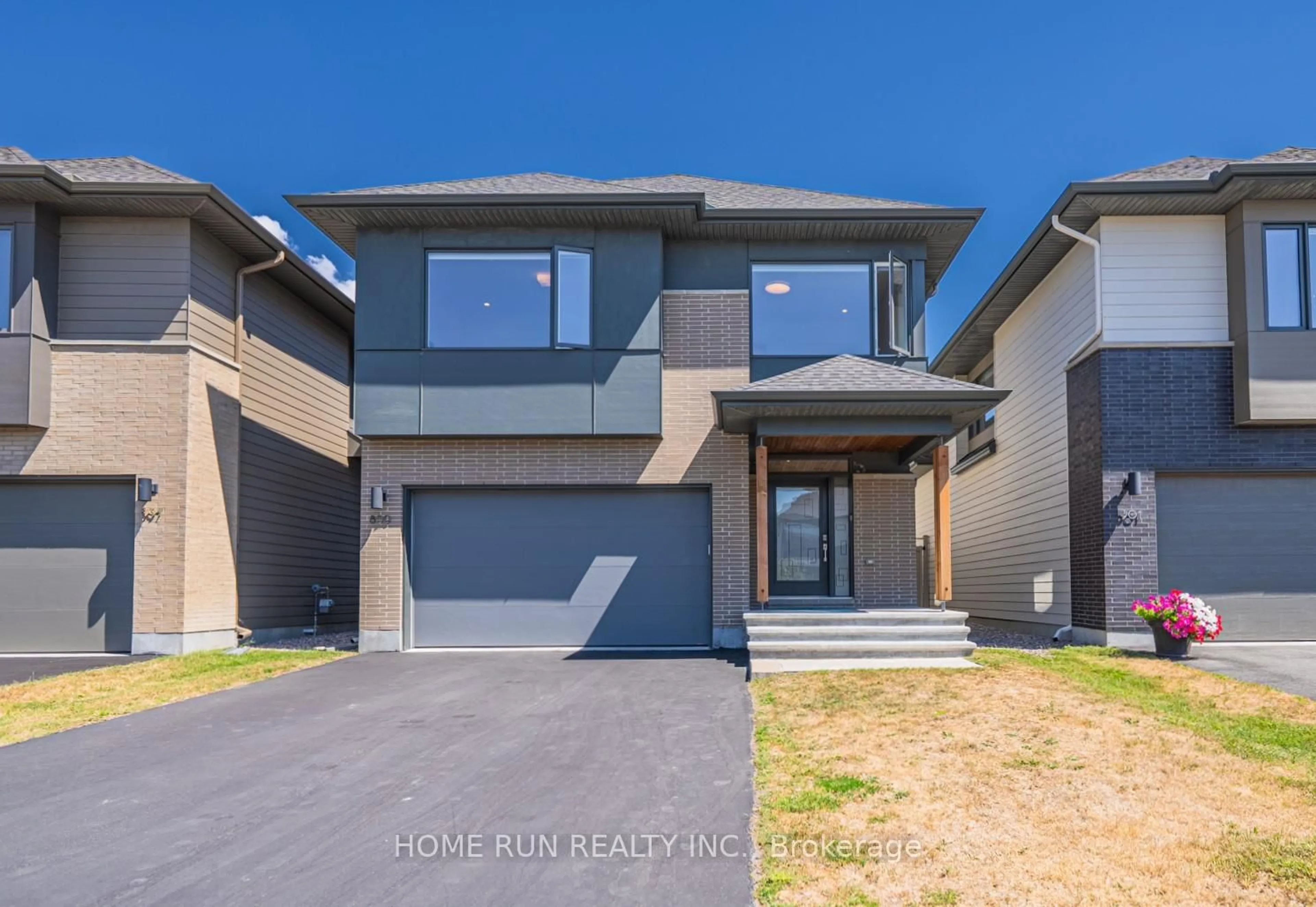 Home with brick exterior material, street for 899 Ralph Hennessy Ave, Ottawa Ontario K1X 0B1