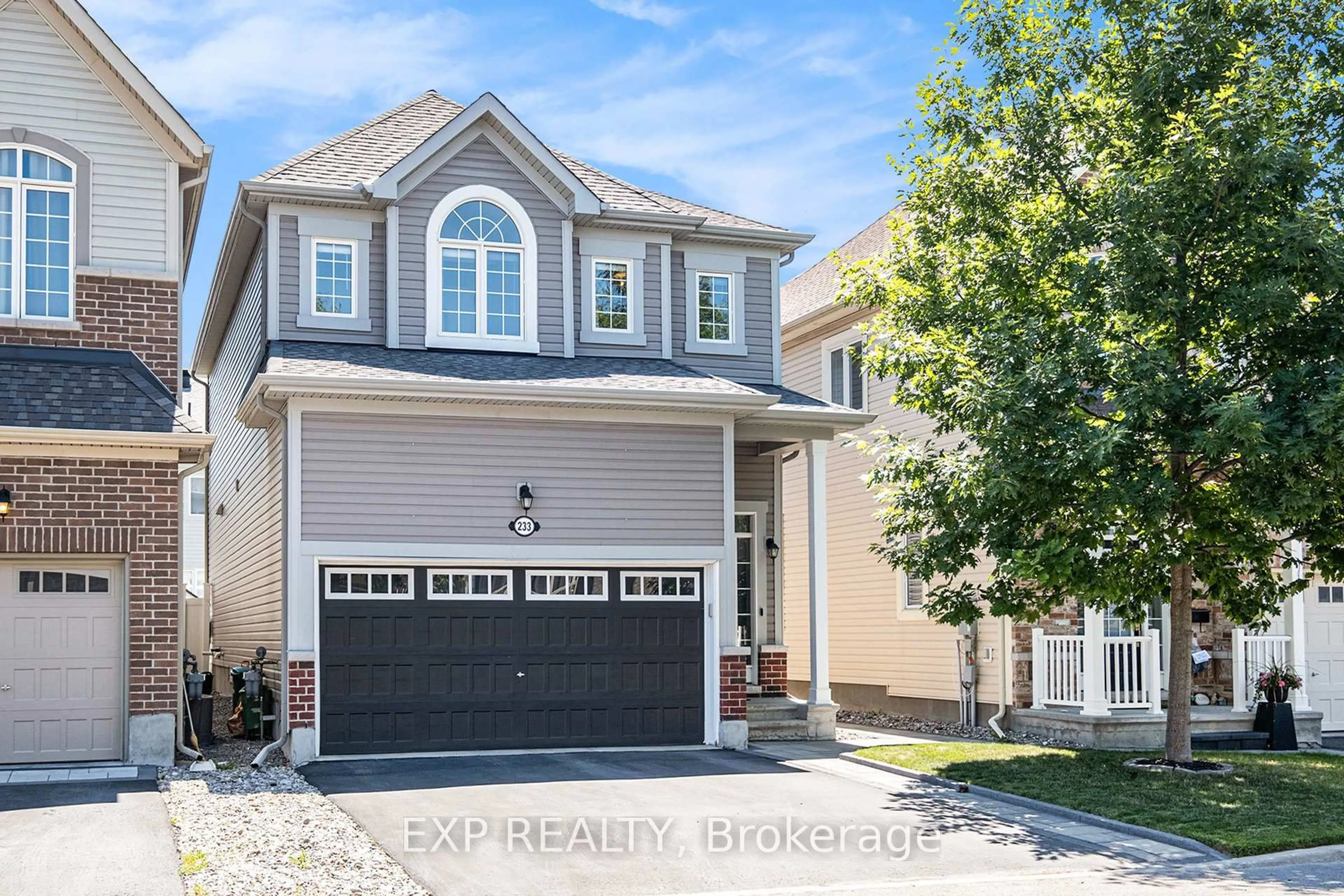 Home with vinyl exterior material, street for 233 Rivertree St, Ottawa Ontario K2M 0J4