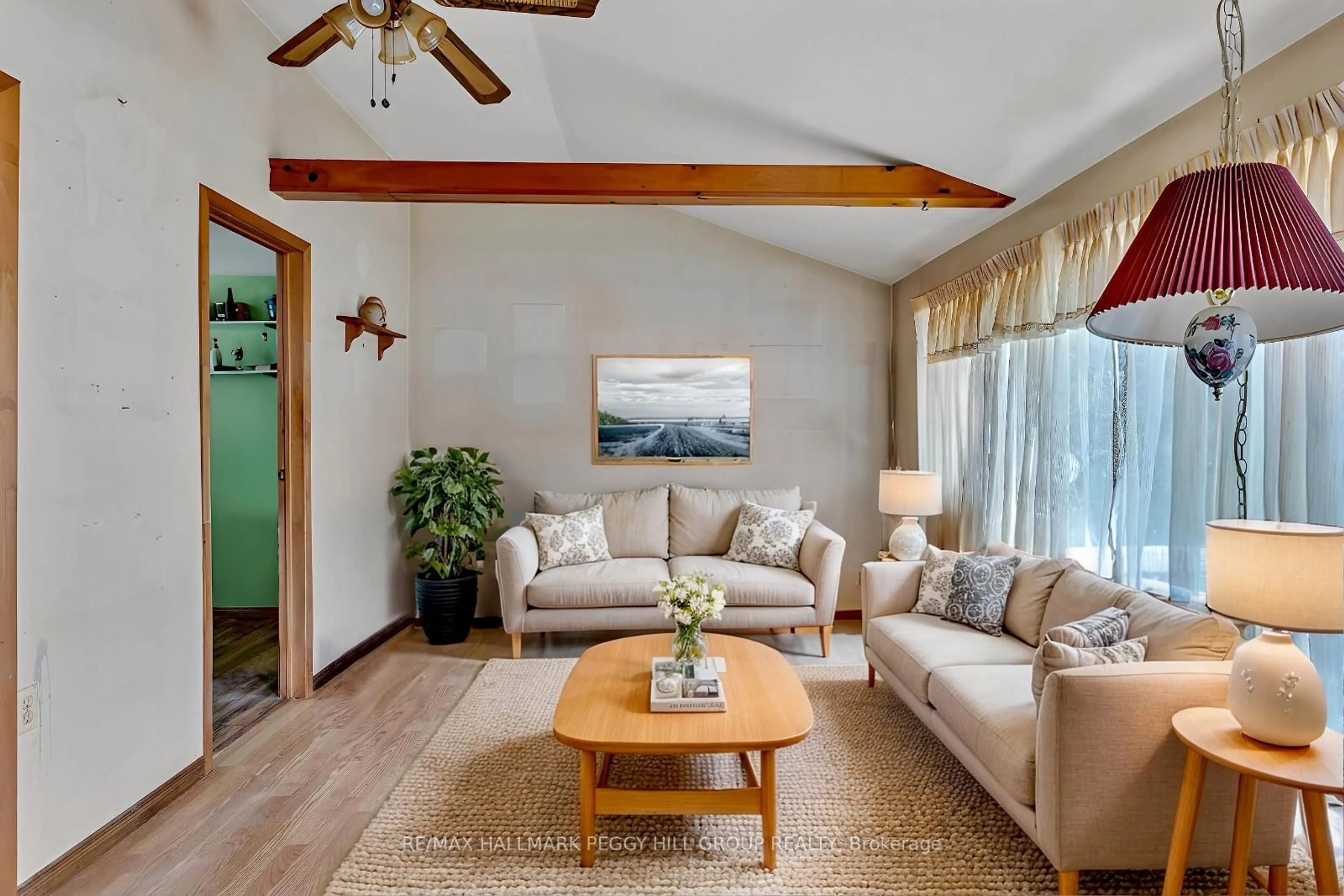 Living room with furniture, wood/laminate floor for 436 Kennedy Dr, Trent Lakes Ontario K0M 1A0