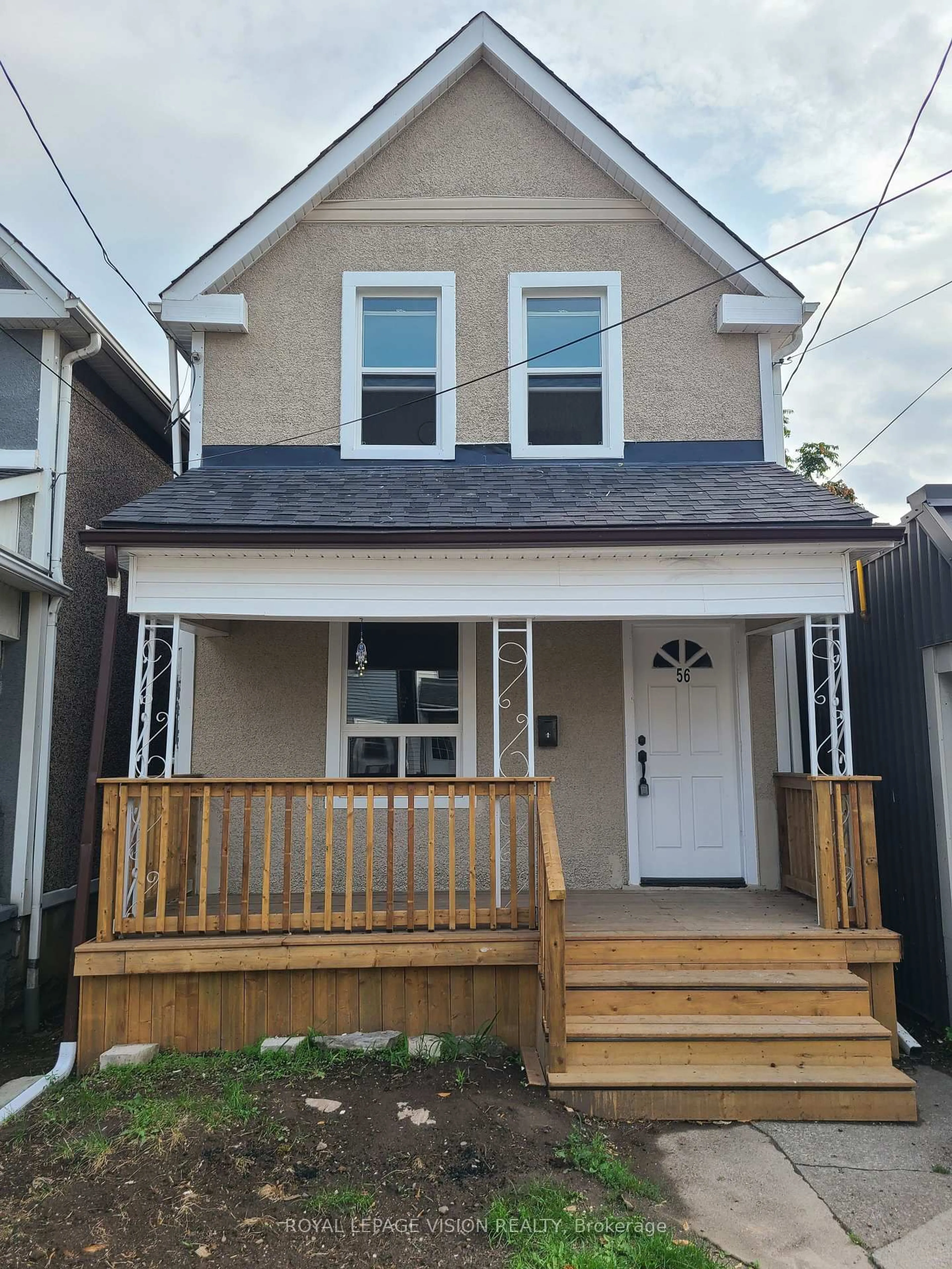 Home with vinyl exterior material, street for 56 Munroe St, Hamilton Ontario L8L 3V7