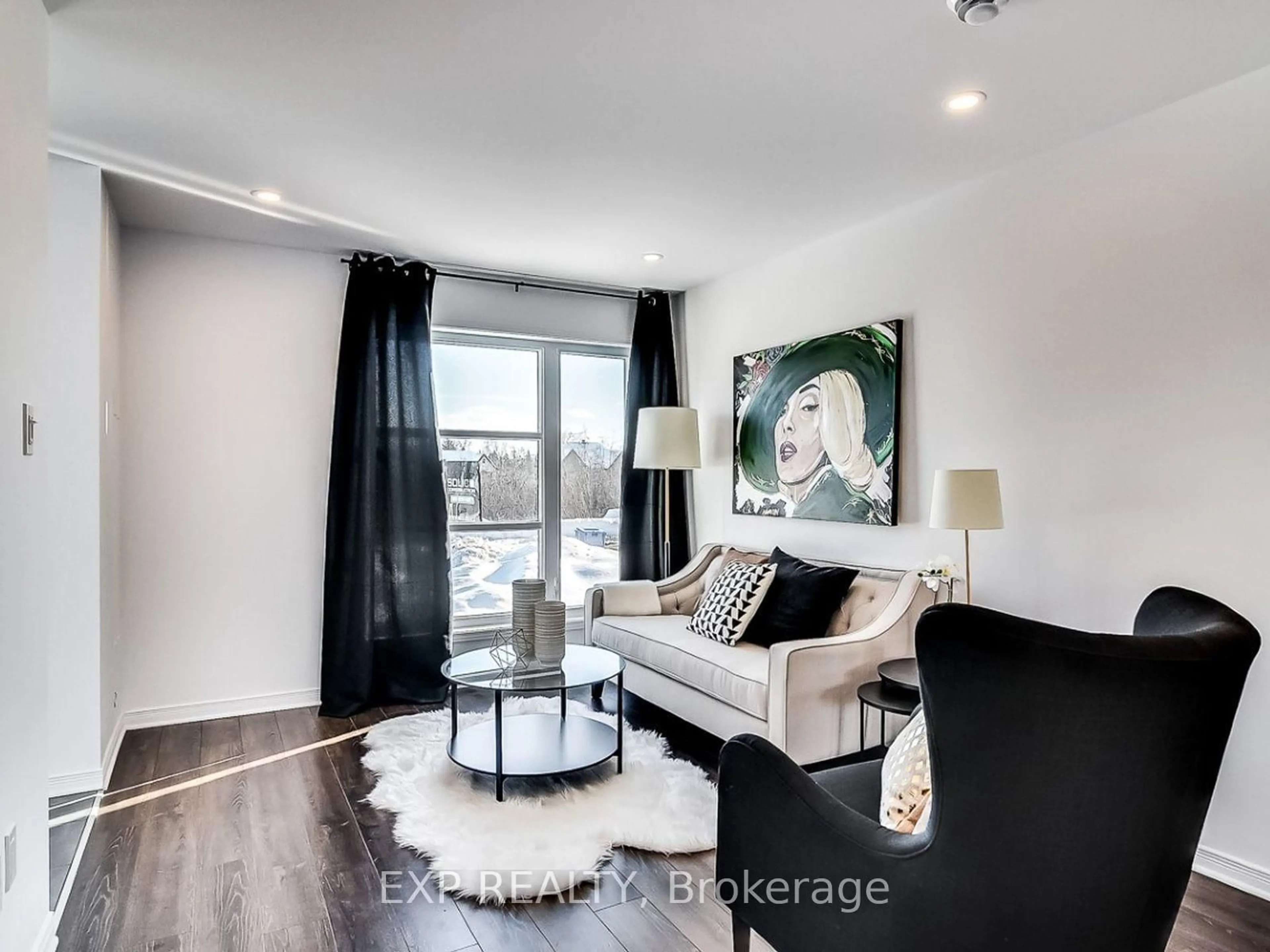 Living room with furniture, wood/laminate floor for 79 Carpe St, Casselman Ontario K0A 1M0