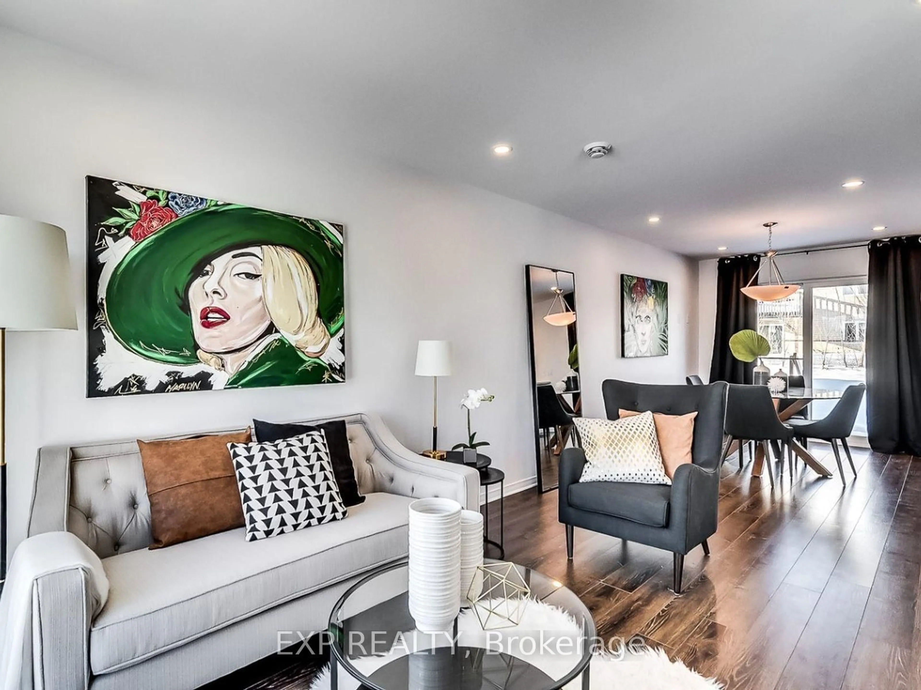 Living room with furniture, wood/laminate floor for 83 Carpe St, Casselman Ontario K0A 1M0